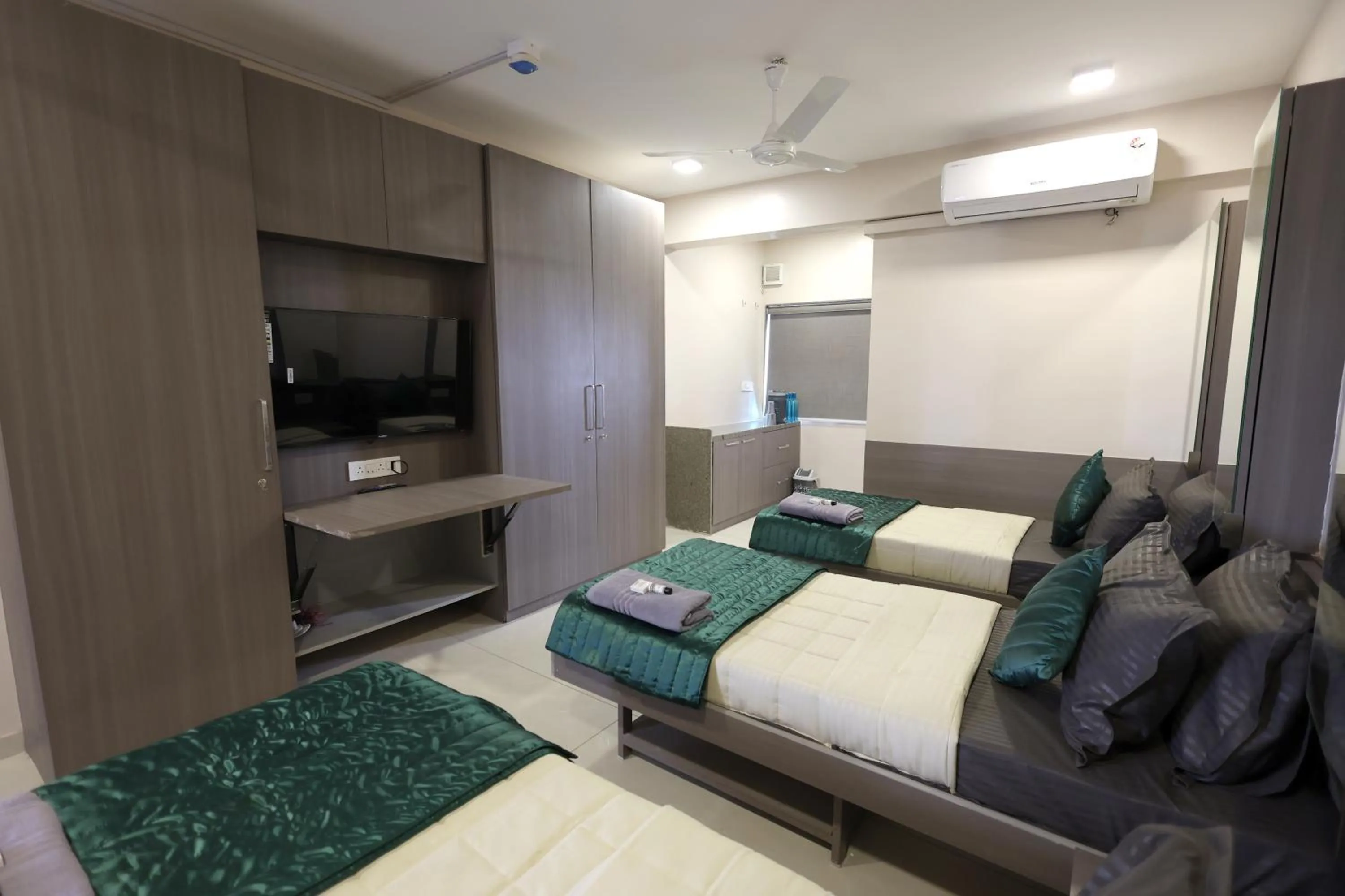 Photo of the whole room, Bed in Greenotel Rooms Hazira, Surat