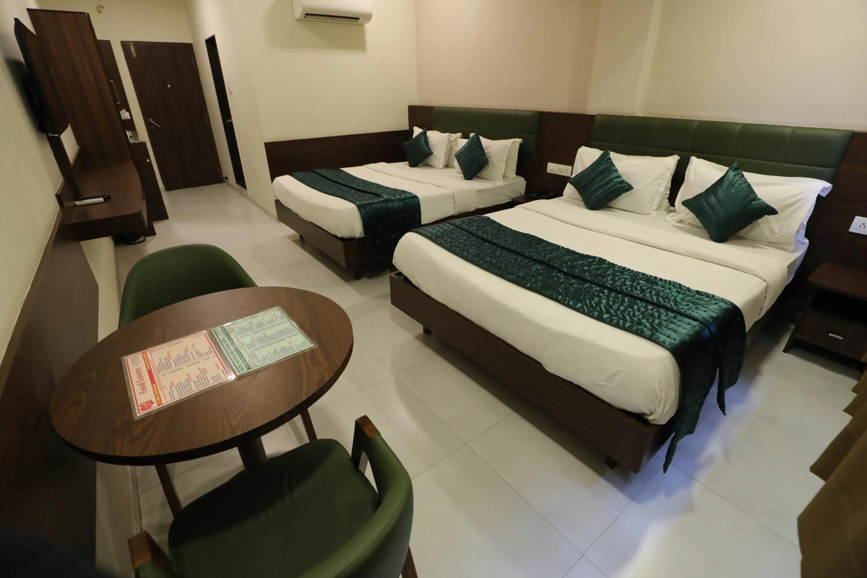 Bed in Greenotel Rooms Hazira, Surat