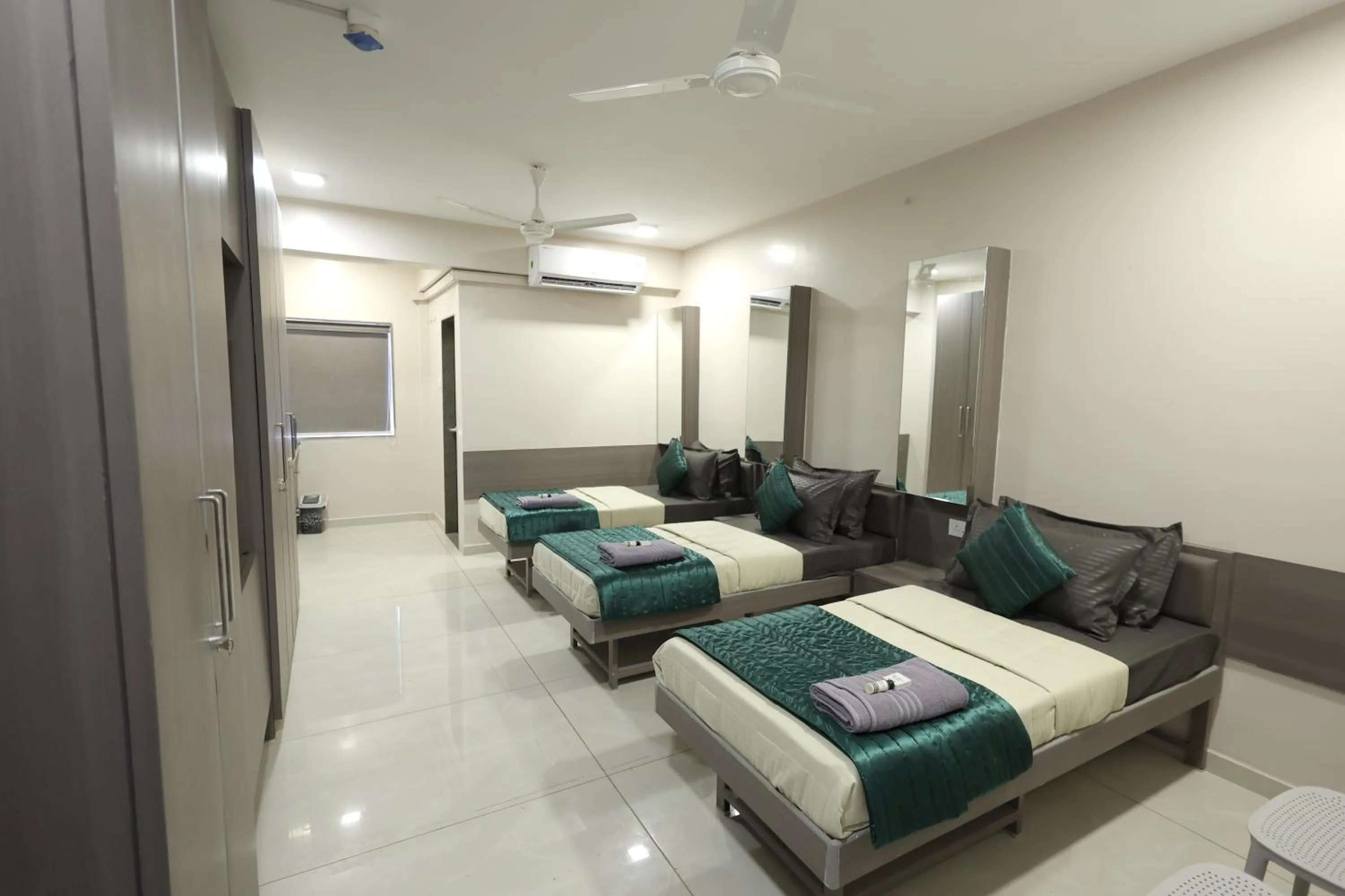 Photo of the whole room, Bed in Greenotel Rooms Hazira, Surat