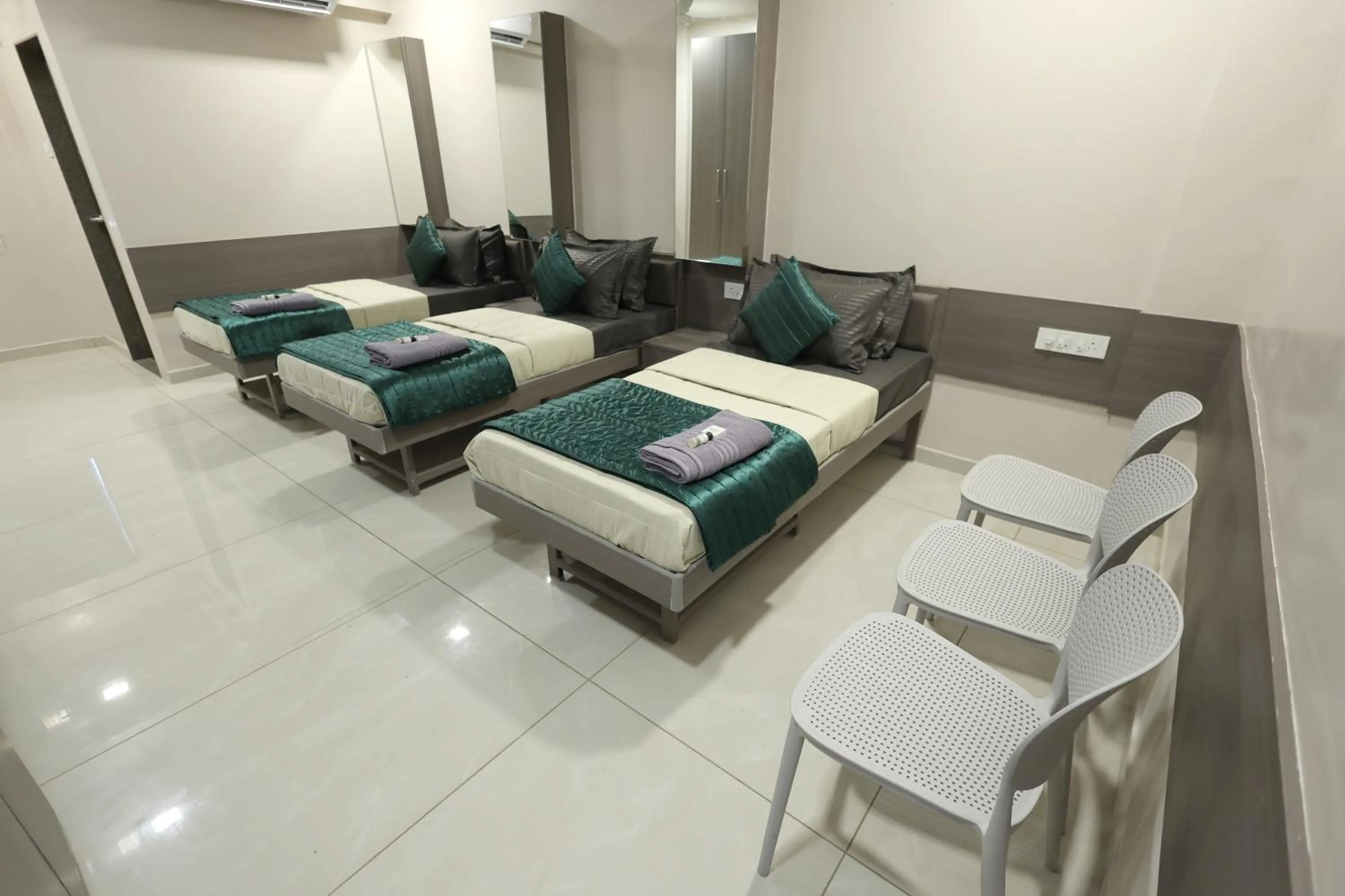 Bed in Greenotel Rooms Hazira, Surat