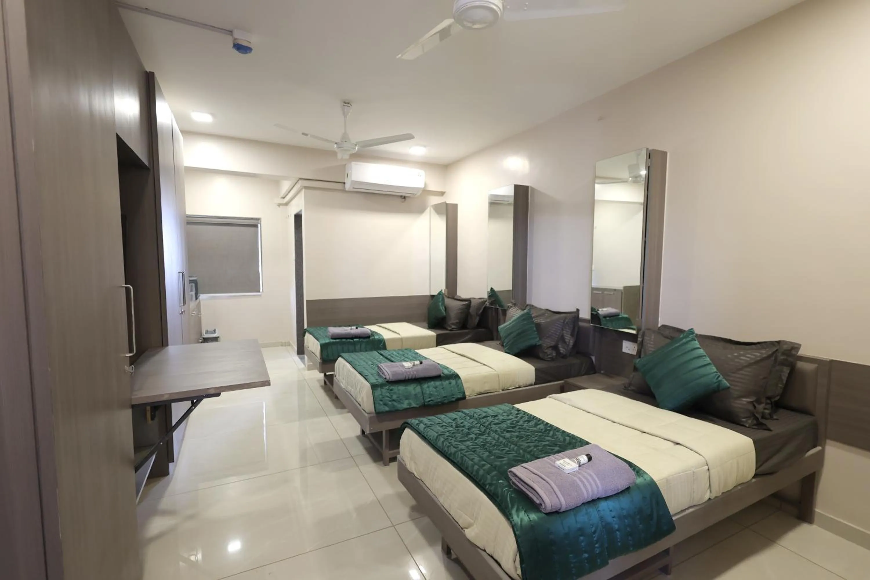Photo of the whole room, Bed in Greenotel Rooms Hazira, Surat