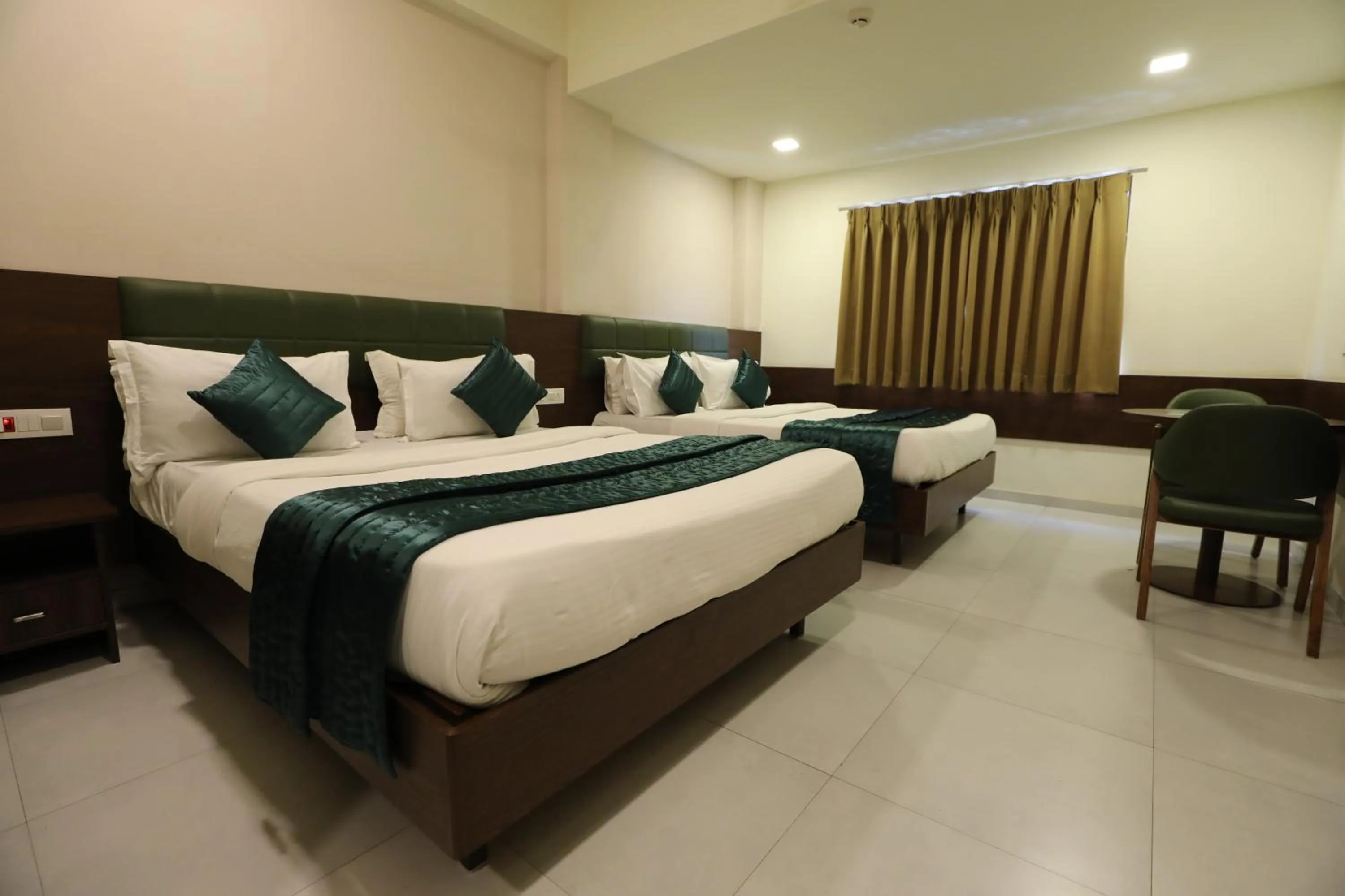 Bed in Greenotel Rooms Hazira, Surat