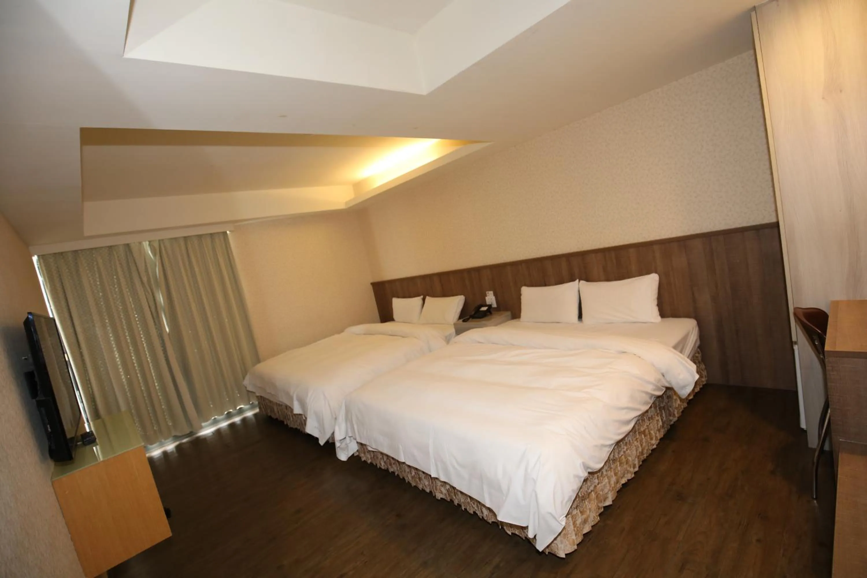 Bed in Tai Shinu Hotel