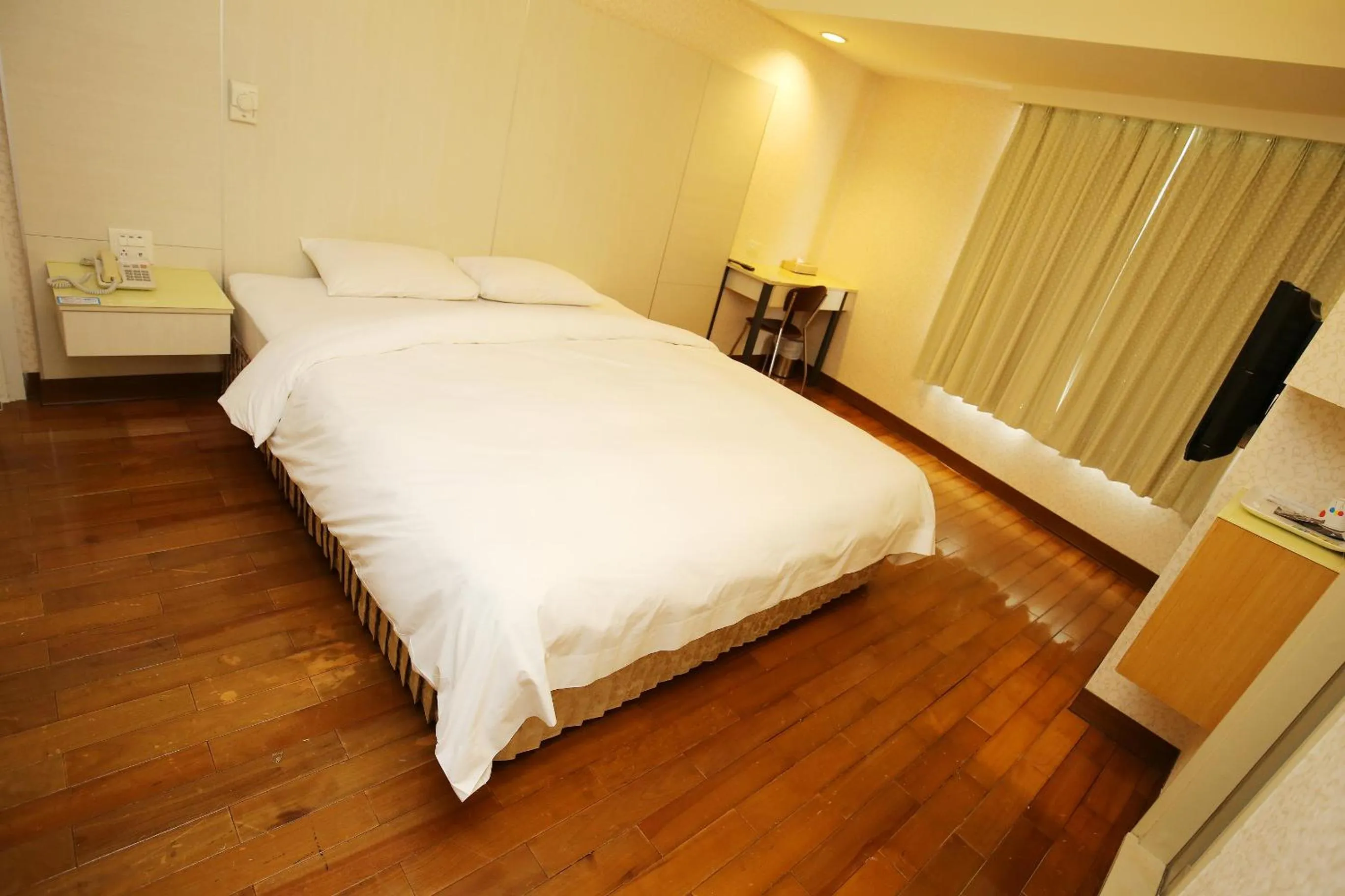 Bed in Tai Shinu Hotel