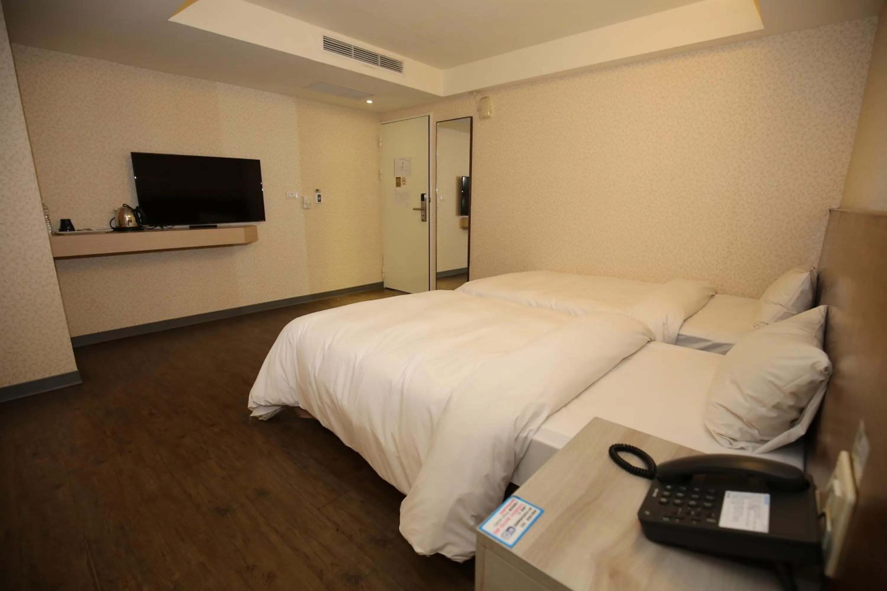 Bed in Tai Shinu Hotel