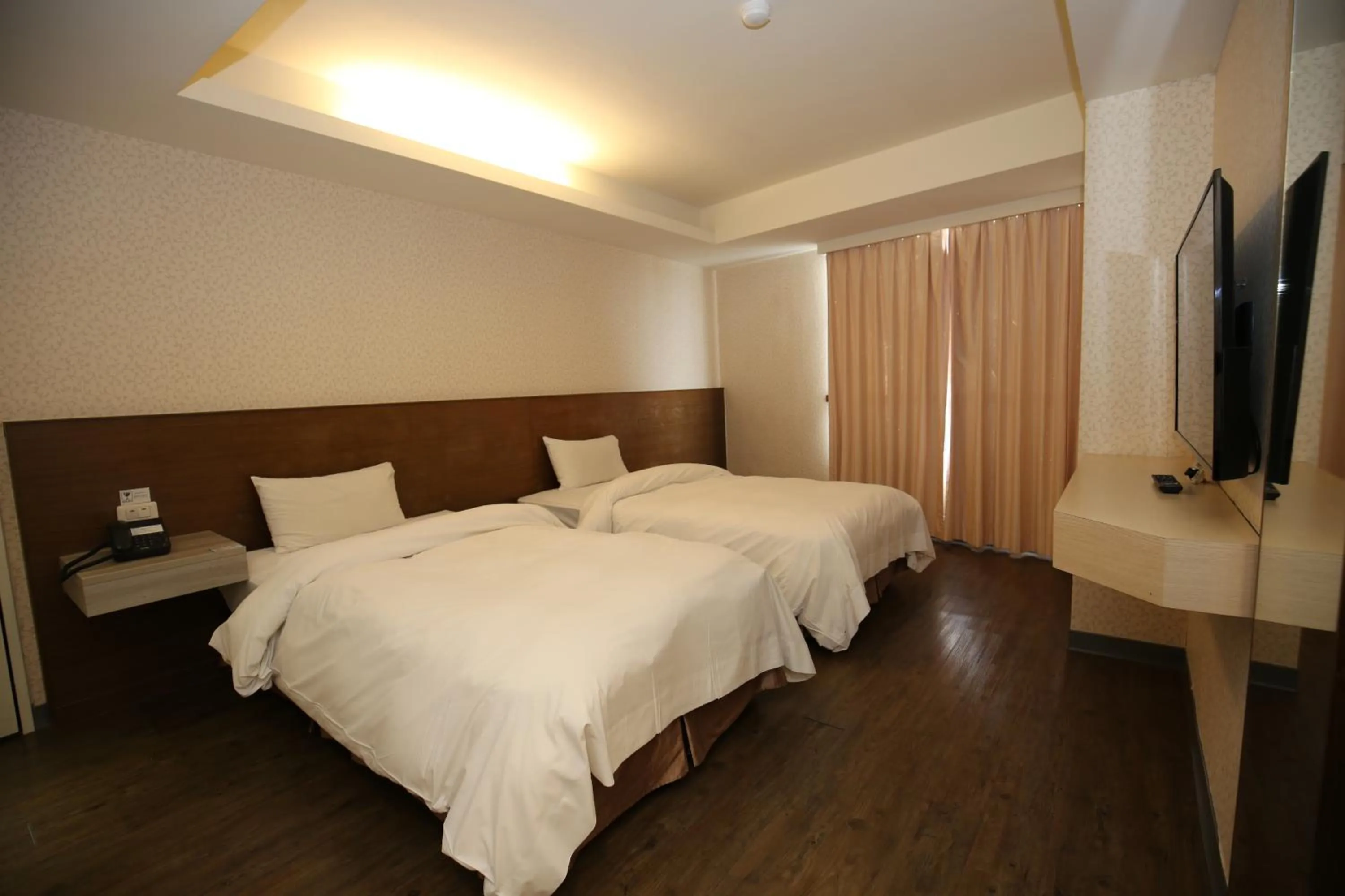 Bed in Tai Shinu Hotel