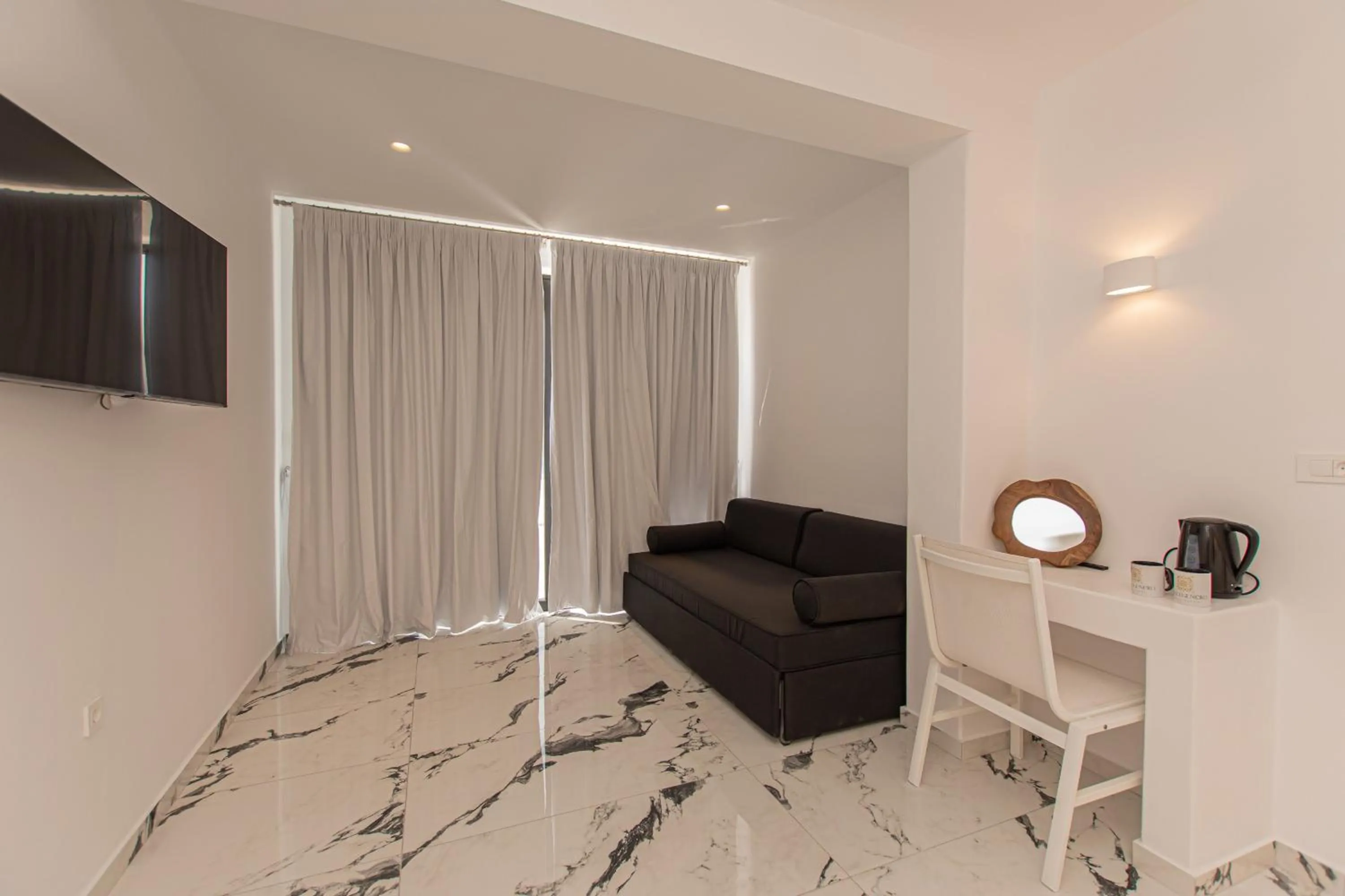 Communal lounge/ TV room in Bianco a Nero Mykonos