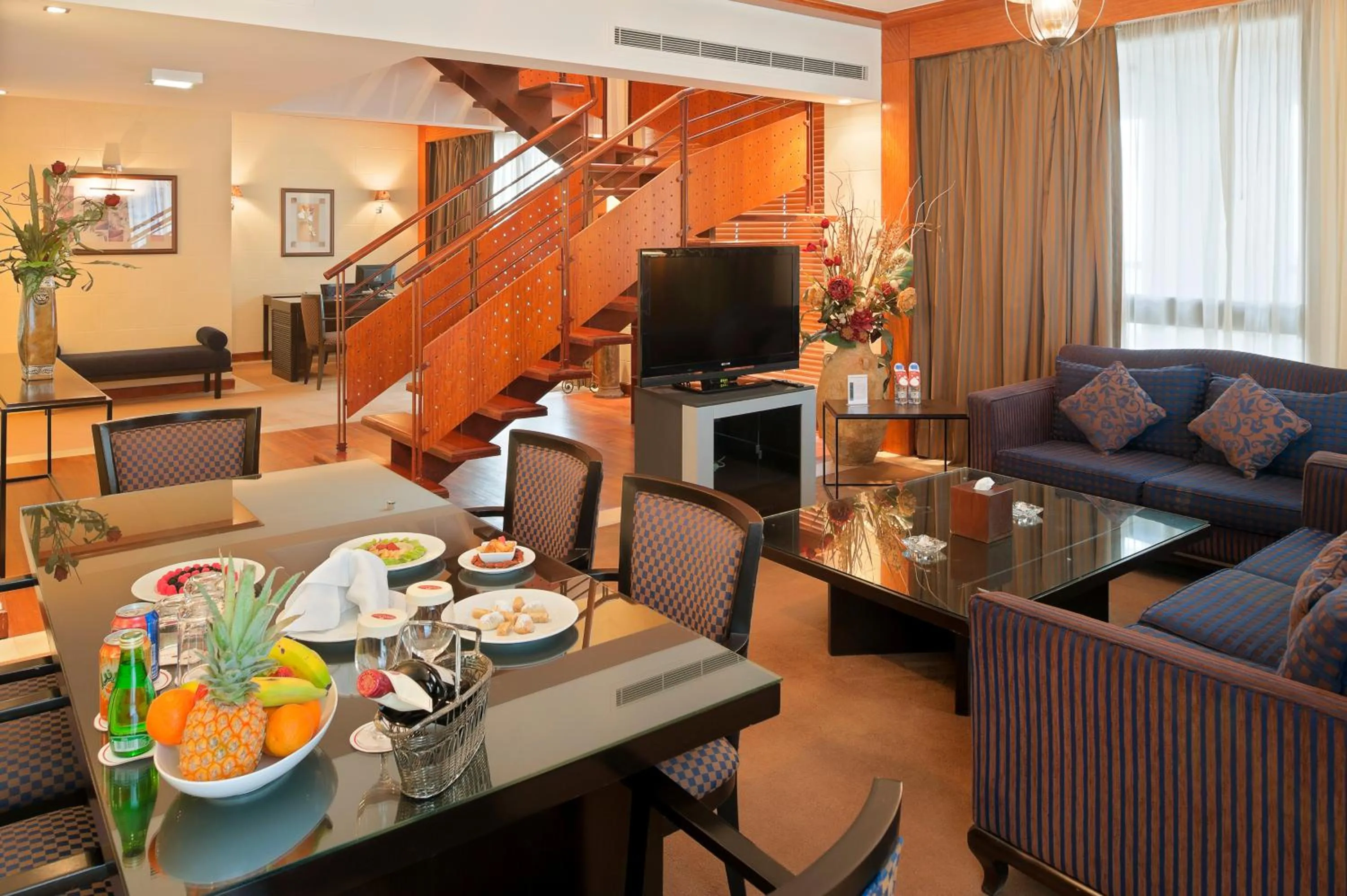 Communal lounge/ TV room in Crowne Plaza Beirut by IHG