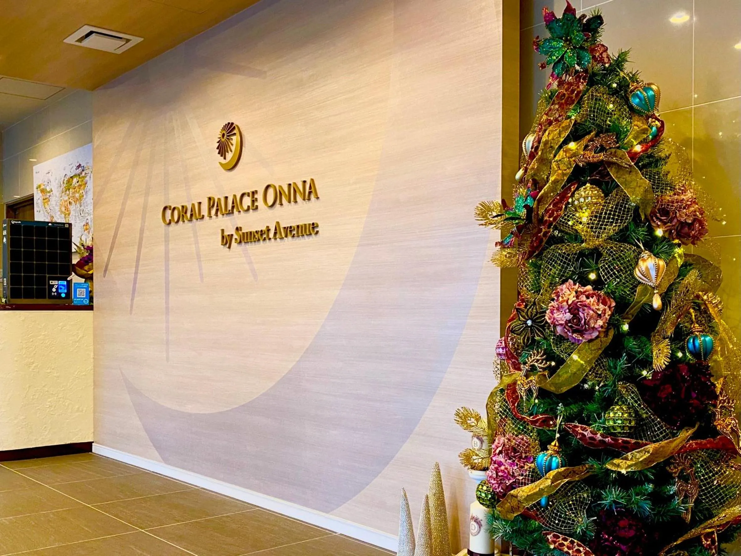 Property logo or sign in Coral Palace Onna by Sunset Avenue