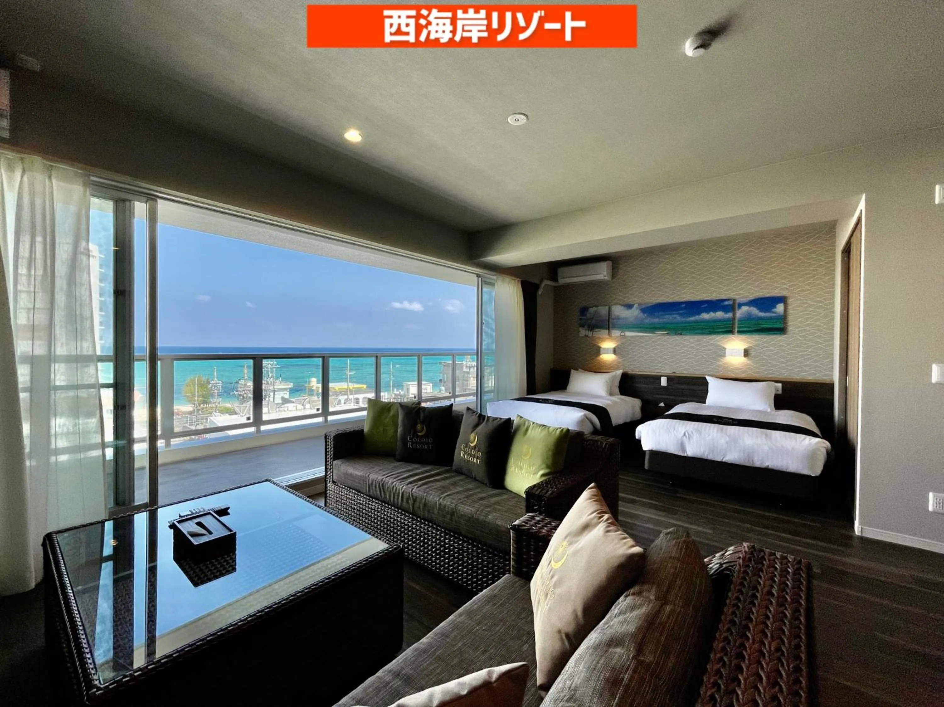 Living room, Bed in Coral Palace Onna by Sunset Avenue