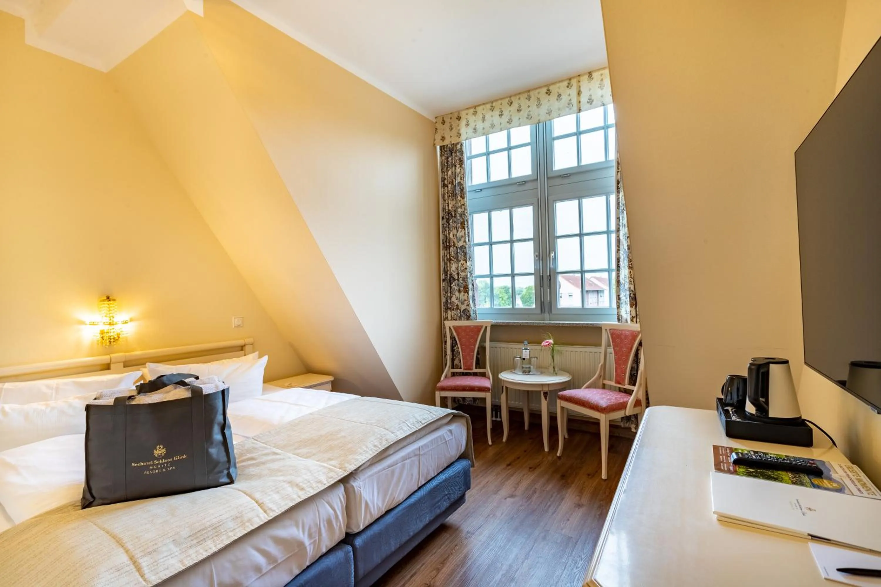 Photo of the whole room, Bed in Seehotel Schloss Klink