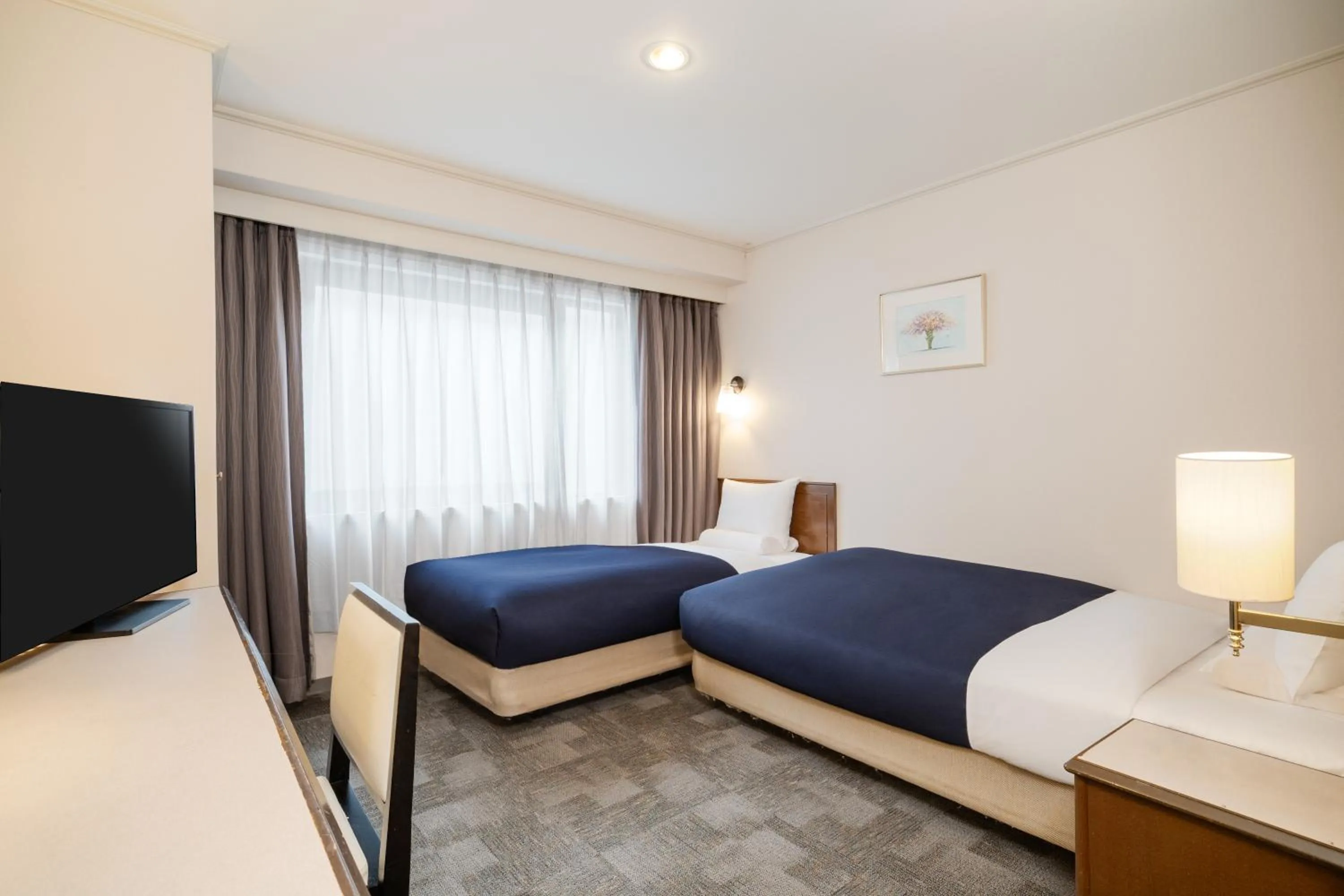 Bed in HOTEL MYSTAYS Hiroshima Peace Park