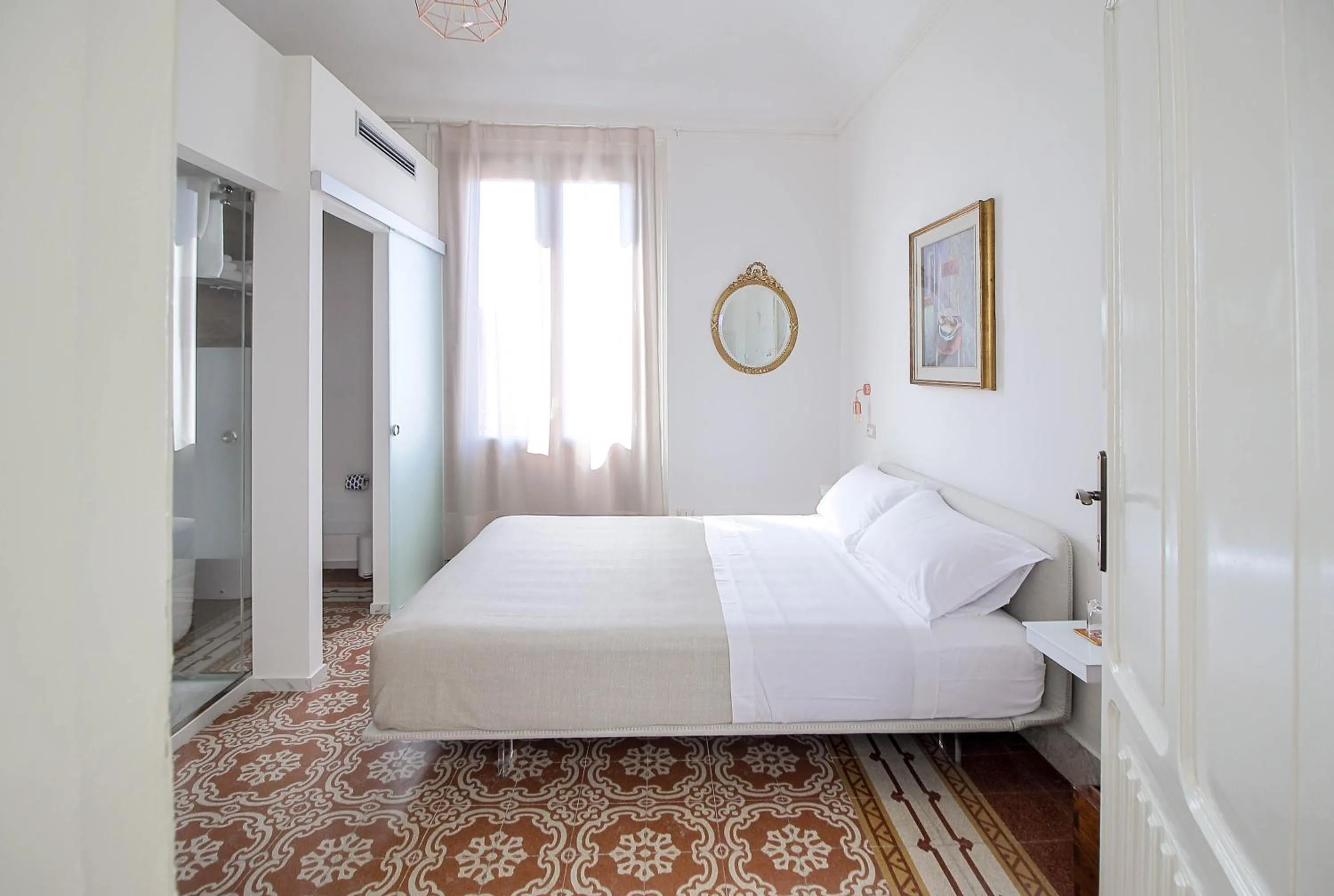 Bed in DOMUS ALERIA Deluxe Rooms