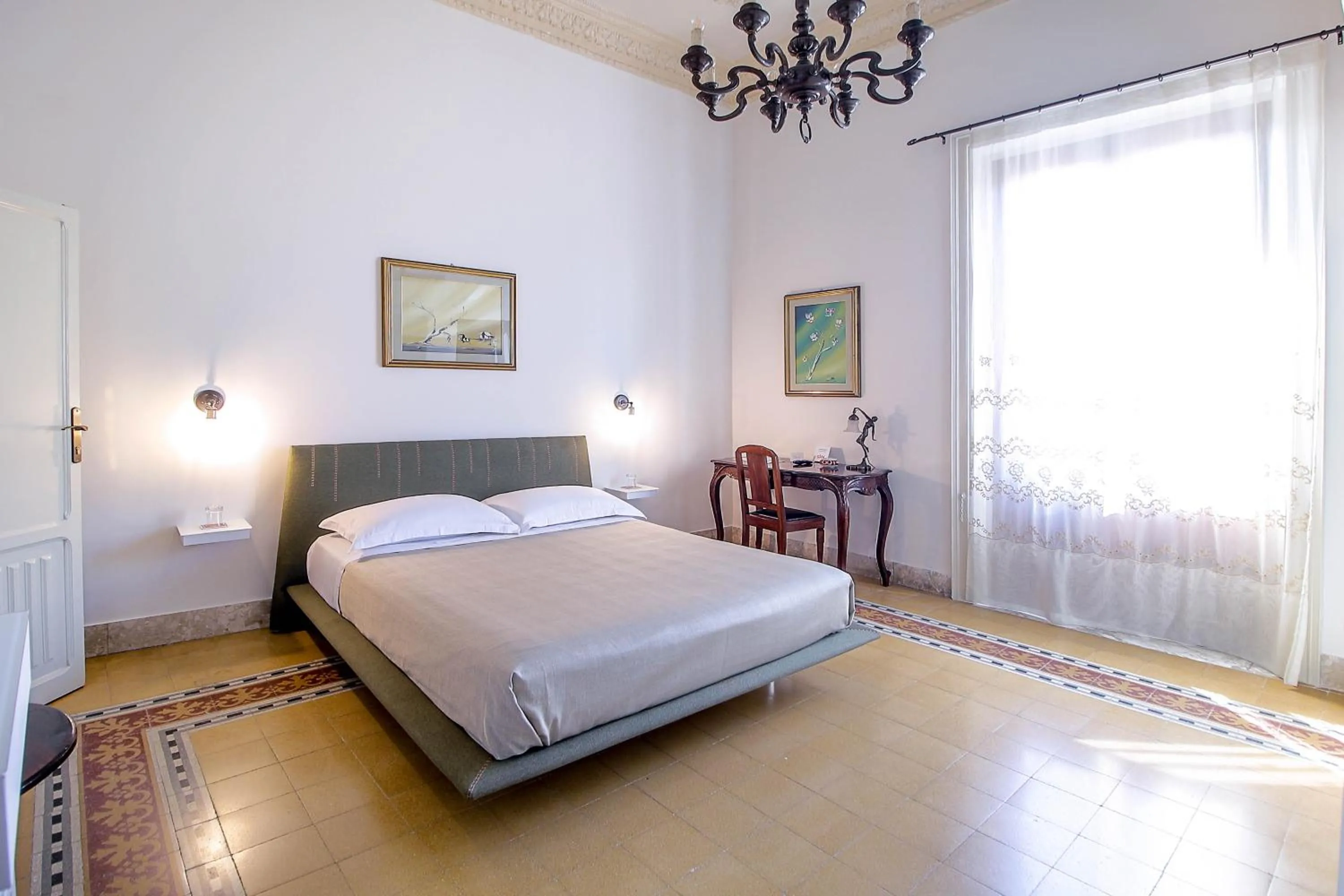 Bed in DOMUS ALERIA Deluxe Rooms