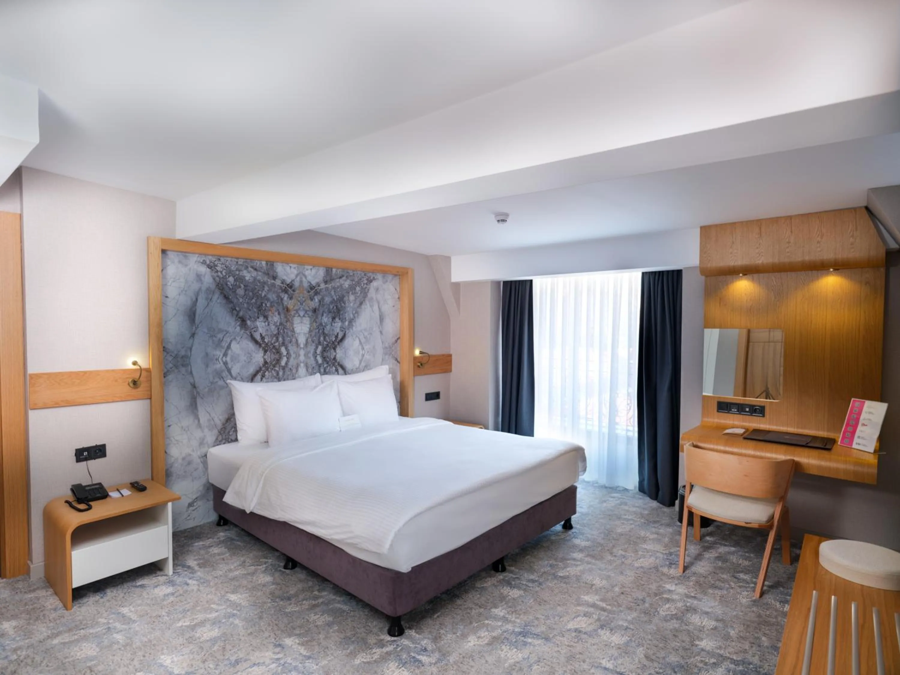 Bed in Grande Arte Hotel