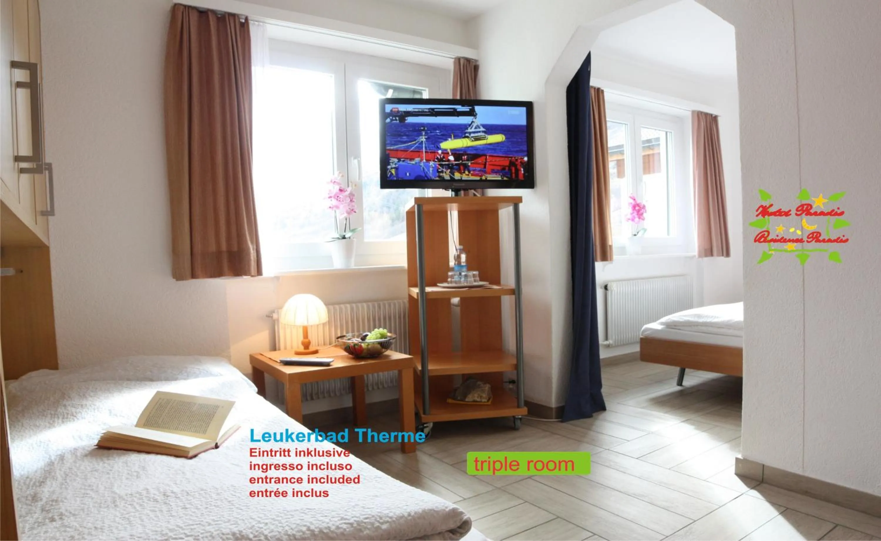 Communal lounge/ TV room, Bed in Hotel Paradis-Leukerbad-Therme