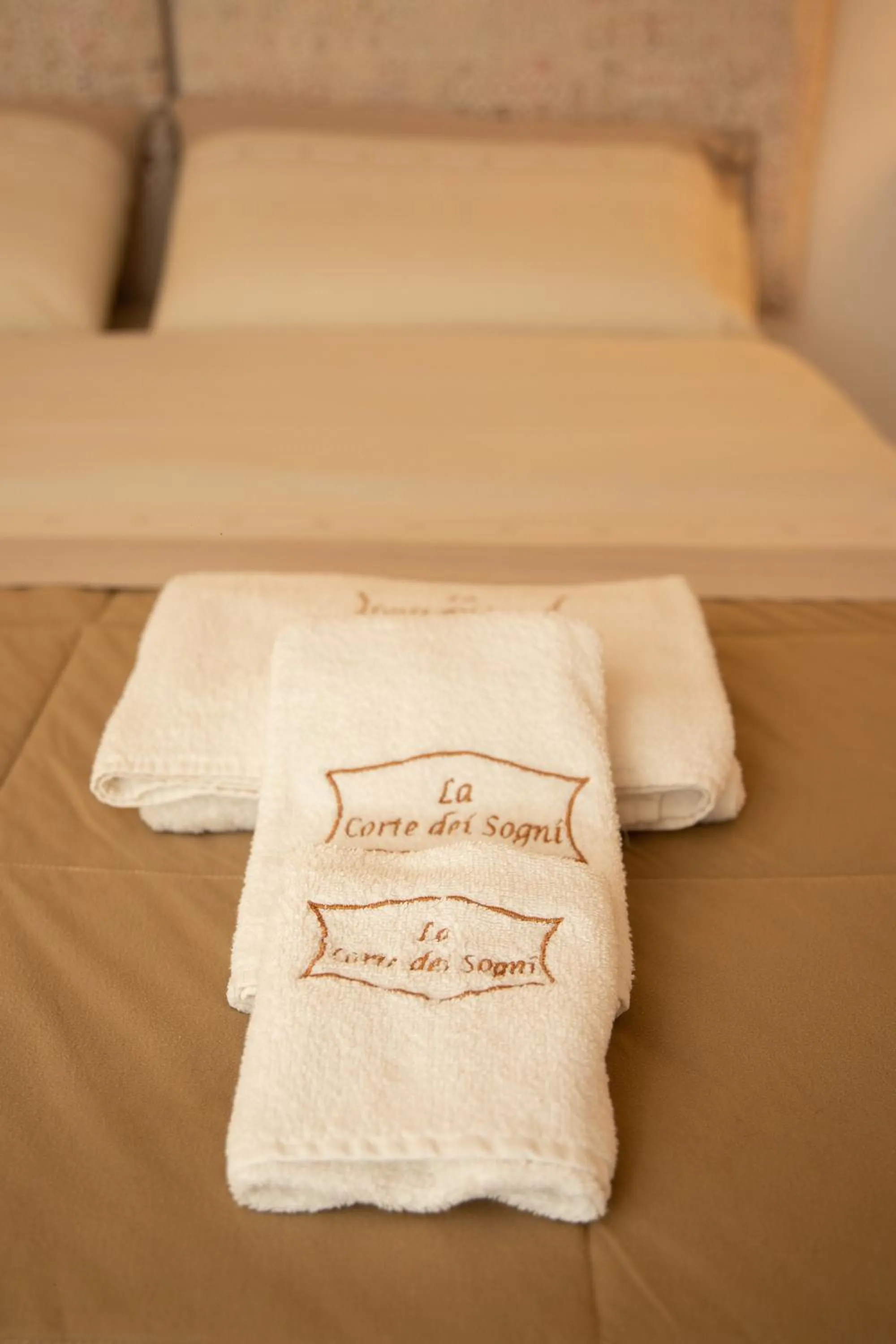 towels, Bed in La Corte dei Sogni