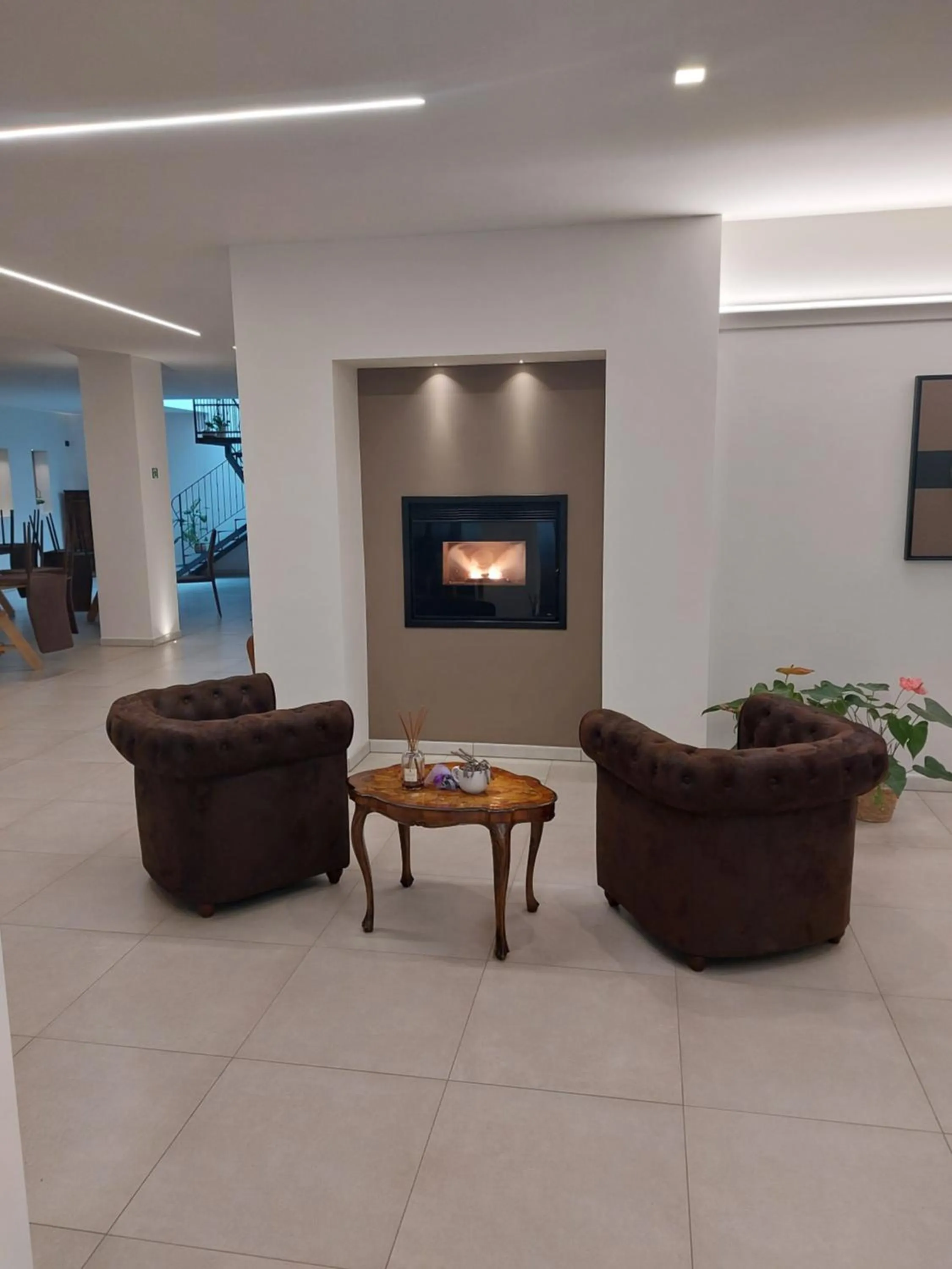 Communal lounge/ TV room in Amiata Suite