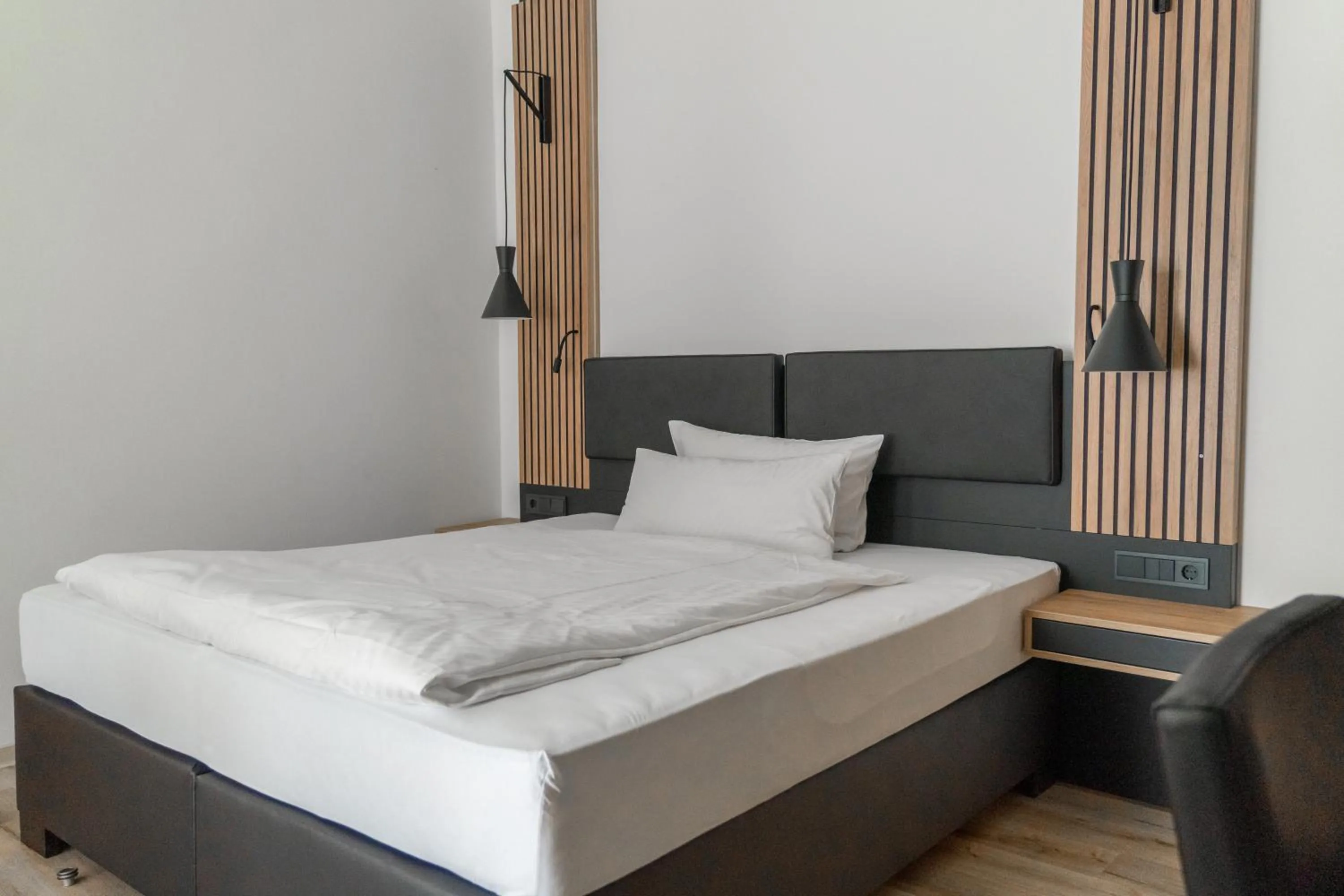 Photo of the whole room, Bed in Ambient Hotel Zum Schwan