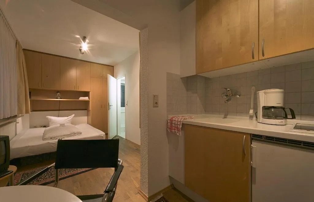 Kitchen or kitchenette, Bed in Appart International Boarding House