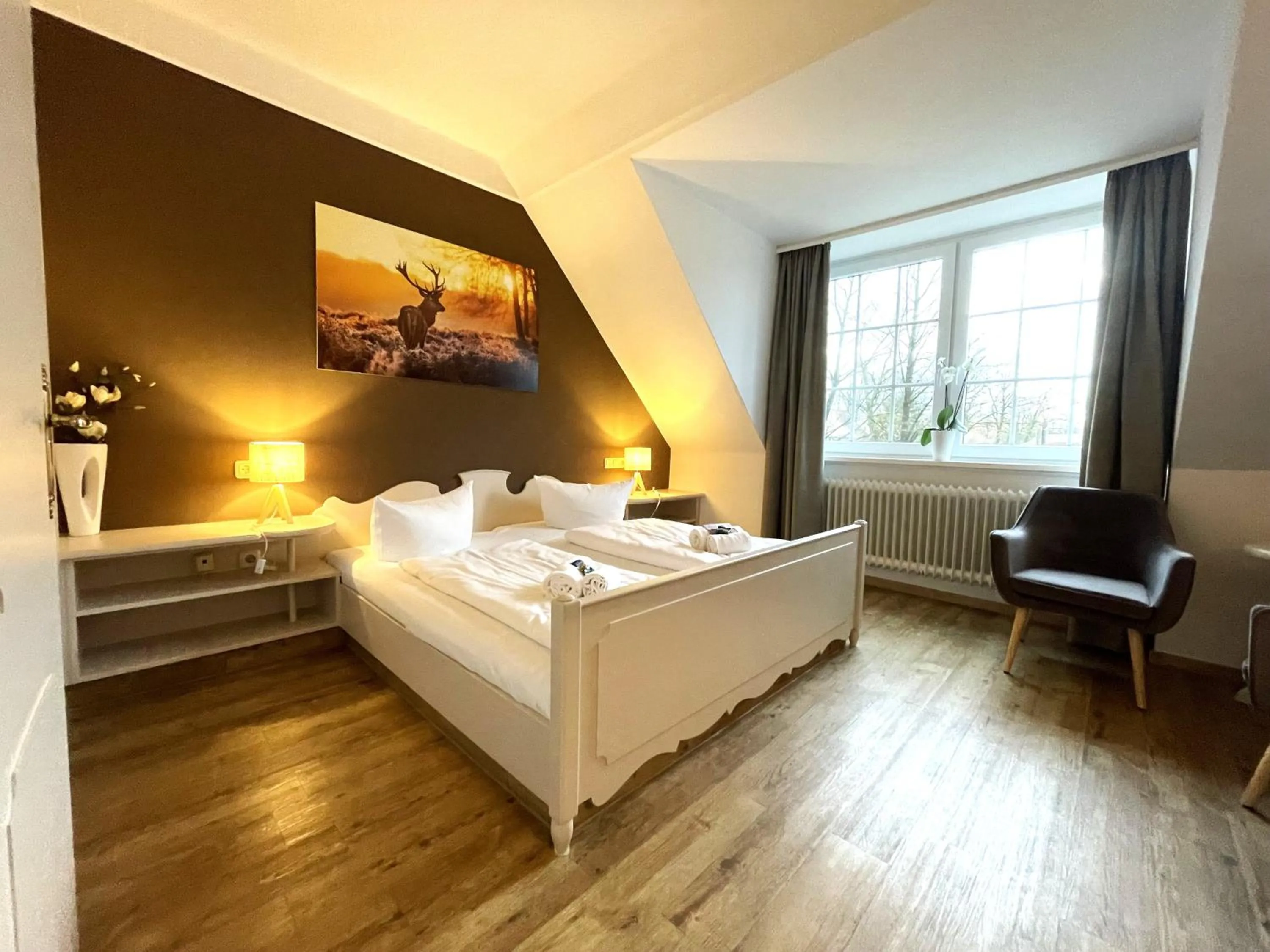 Photo of the whole room, Bed in Landhotel Gutshof im Oertzetal in Oldendorf, Südheide