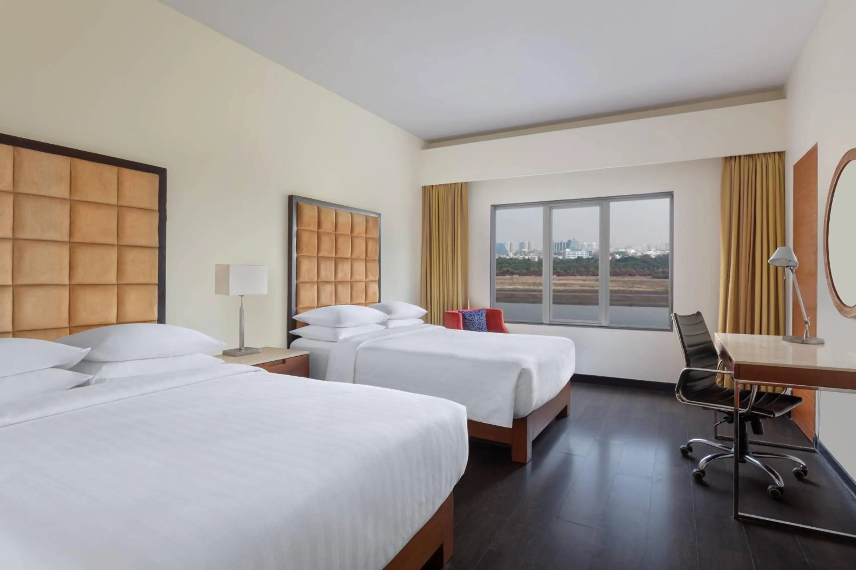Photo of the whole room, Bed in Surat Marriott Hotel