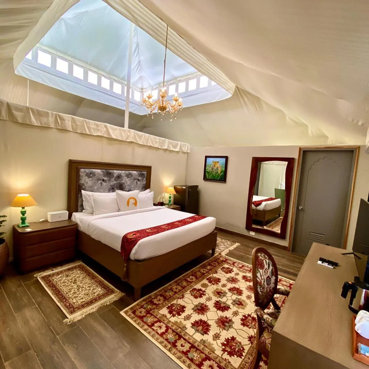 Bed in WelcomHeritage Cheetahgarh Resort & Spa