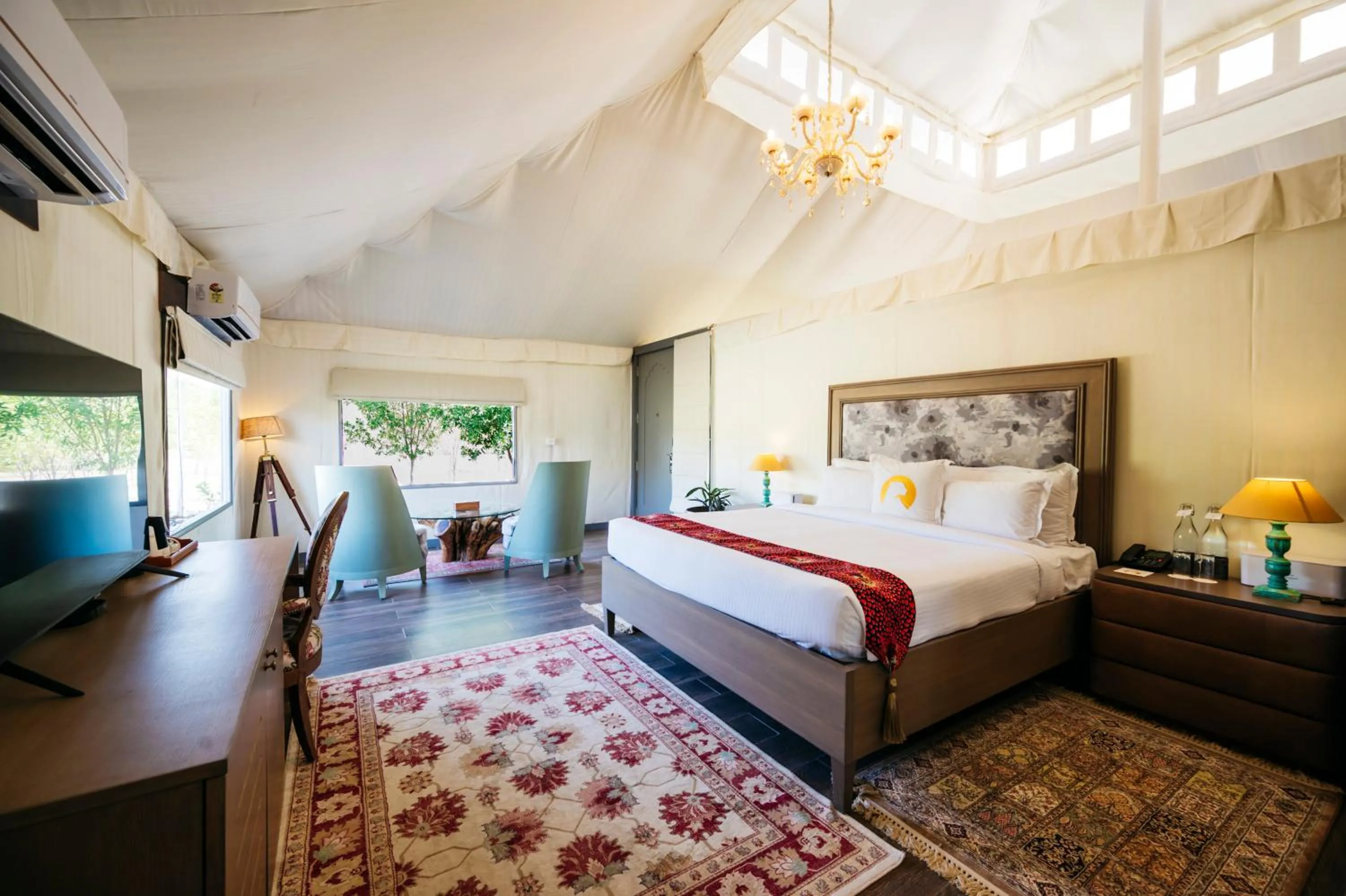 Bed in WelcomHeritage Cheetahgarh Resort & Spa