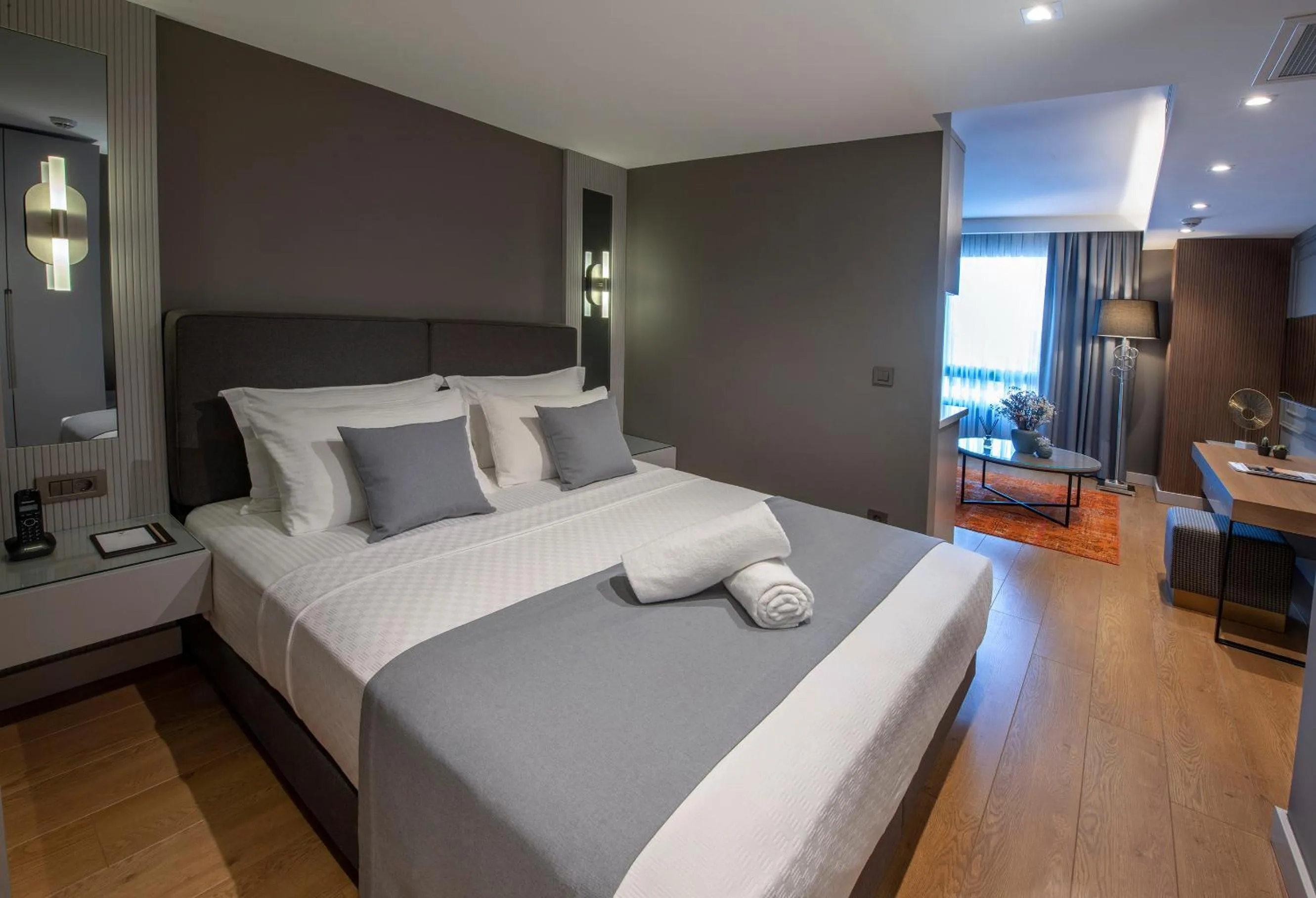 Bed in Valente Suites&Hotel