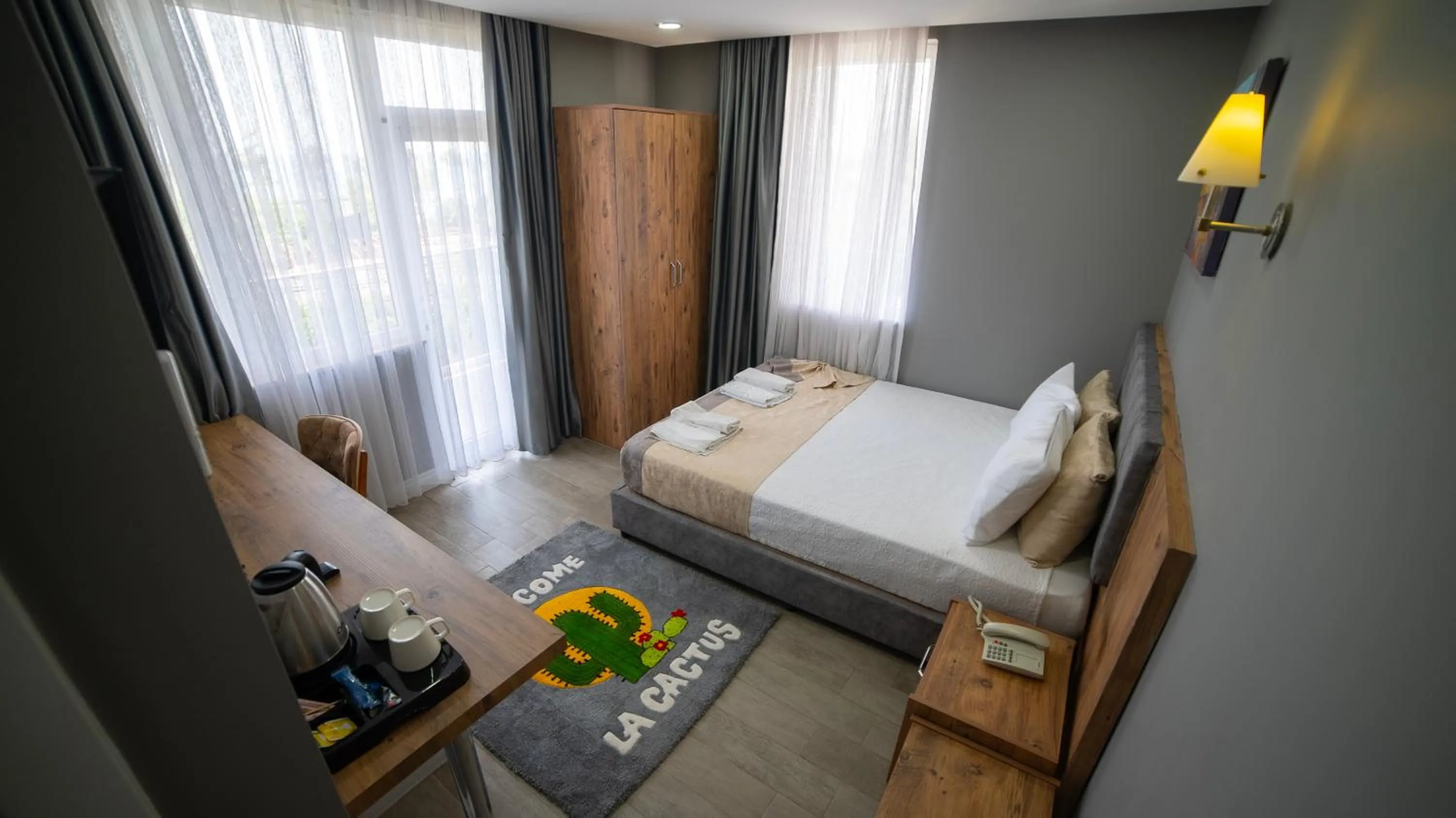 Bed in La Cactus Boutique Hotel