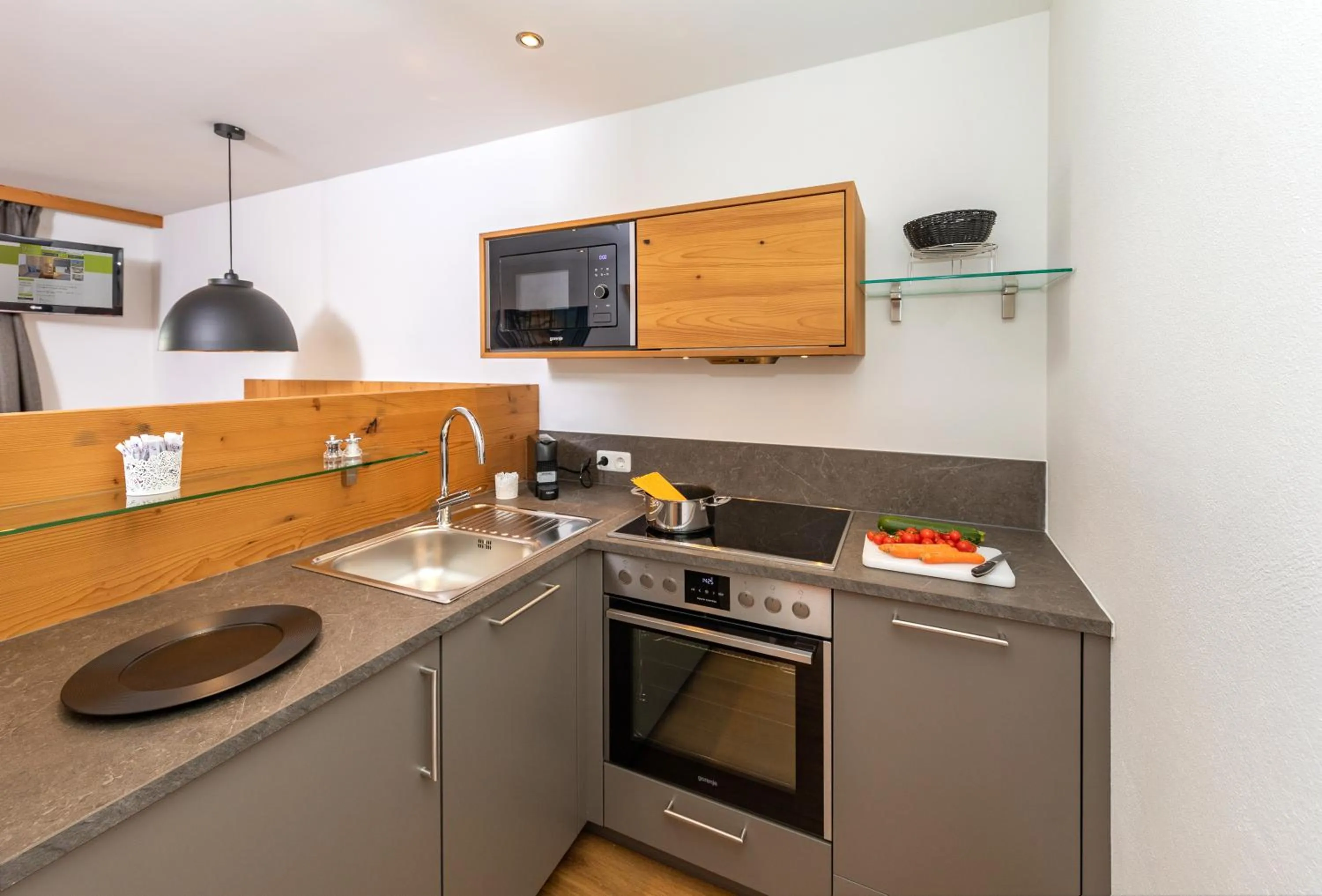 Kitchen or kitchenette in Das Grünholz Aparthotel