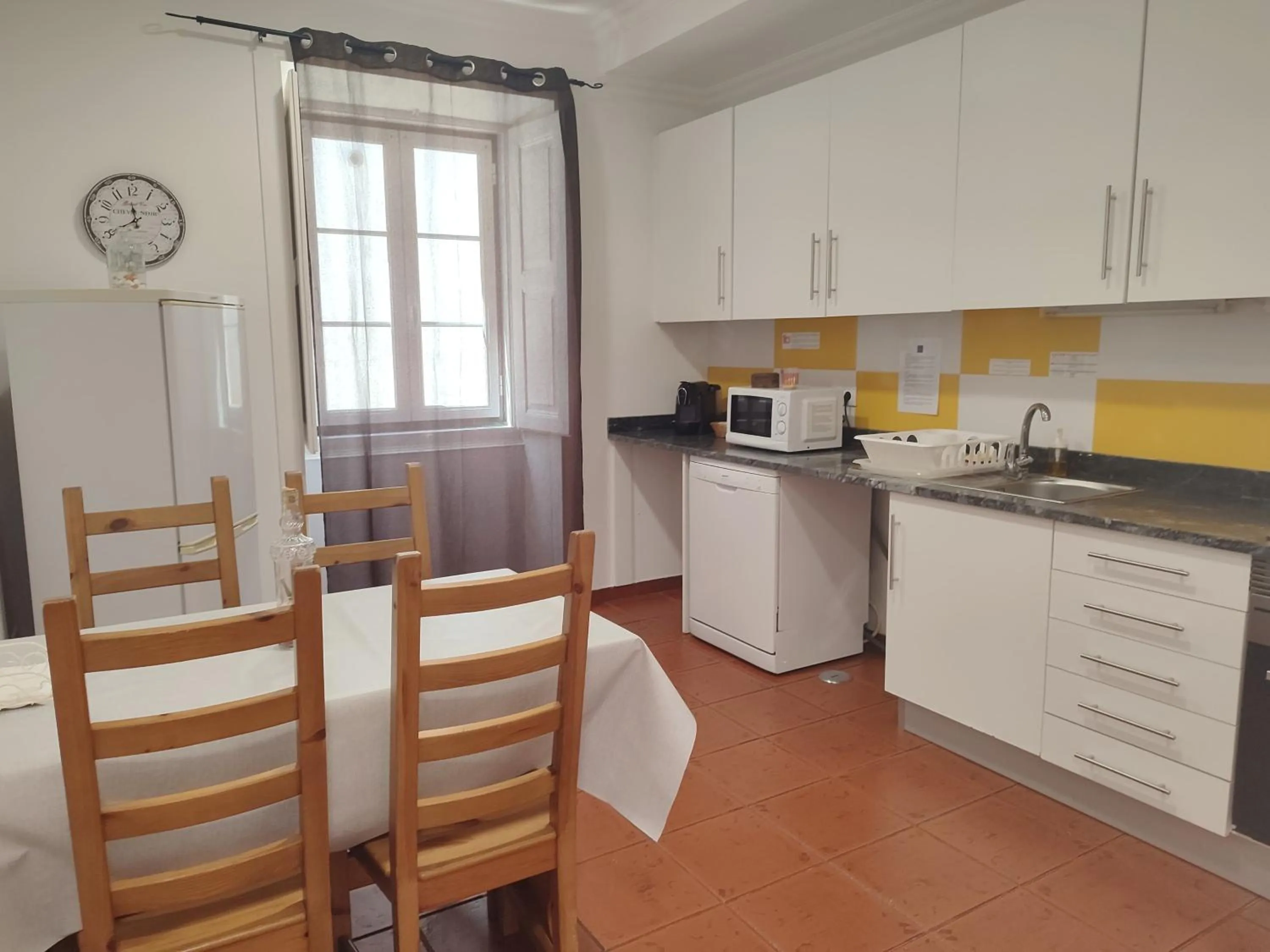 Kitchen or kitchenette in Casas da Biquinha