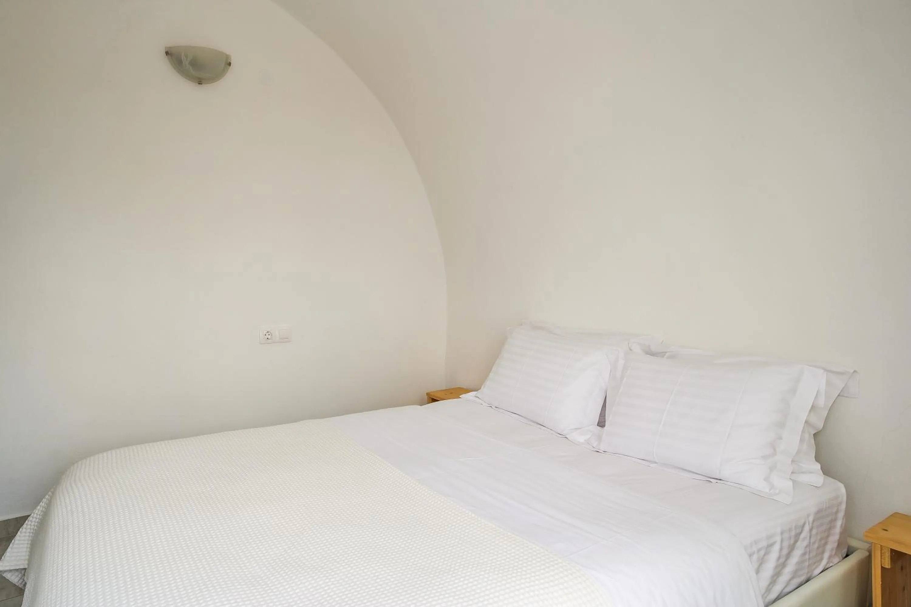 Bed in Exi Sea Side Suites