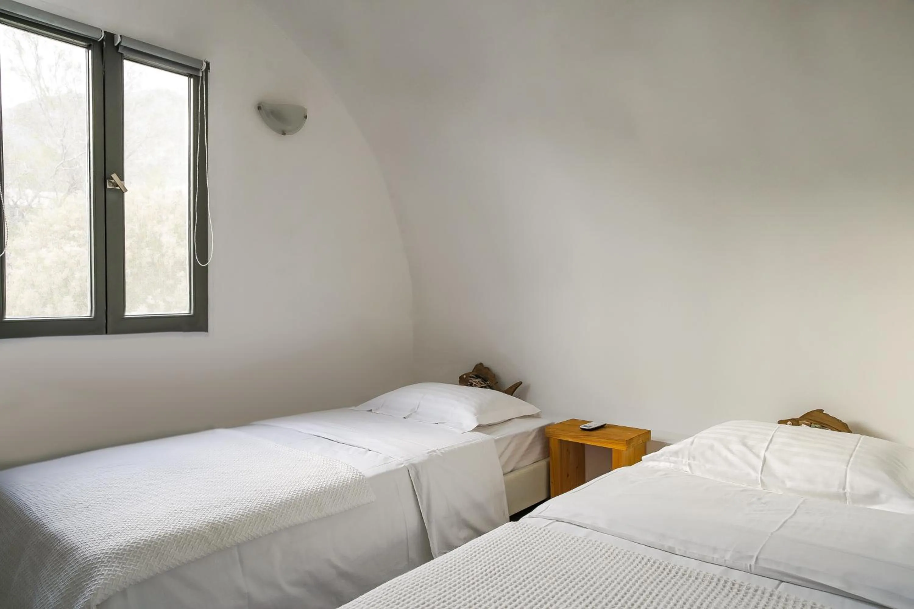 Bed in Exi Sea Side Suites