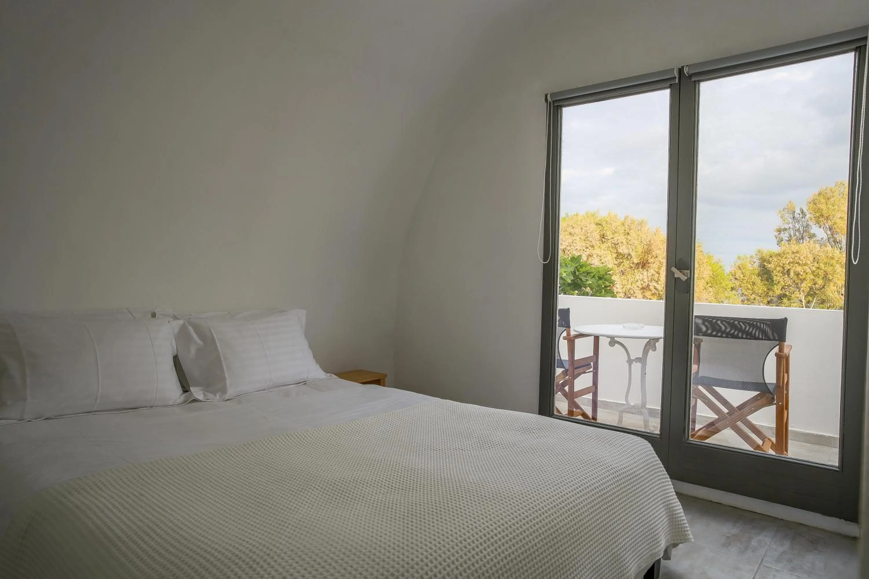 Bed in Exi Sea Side Suites