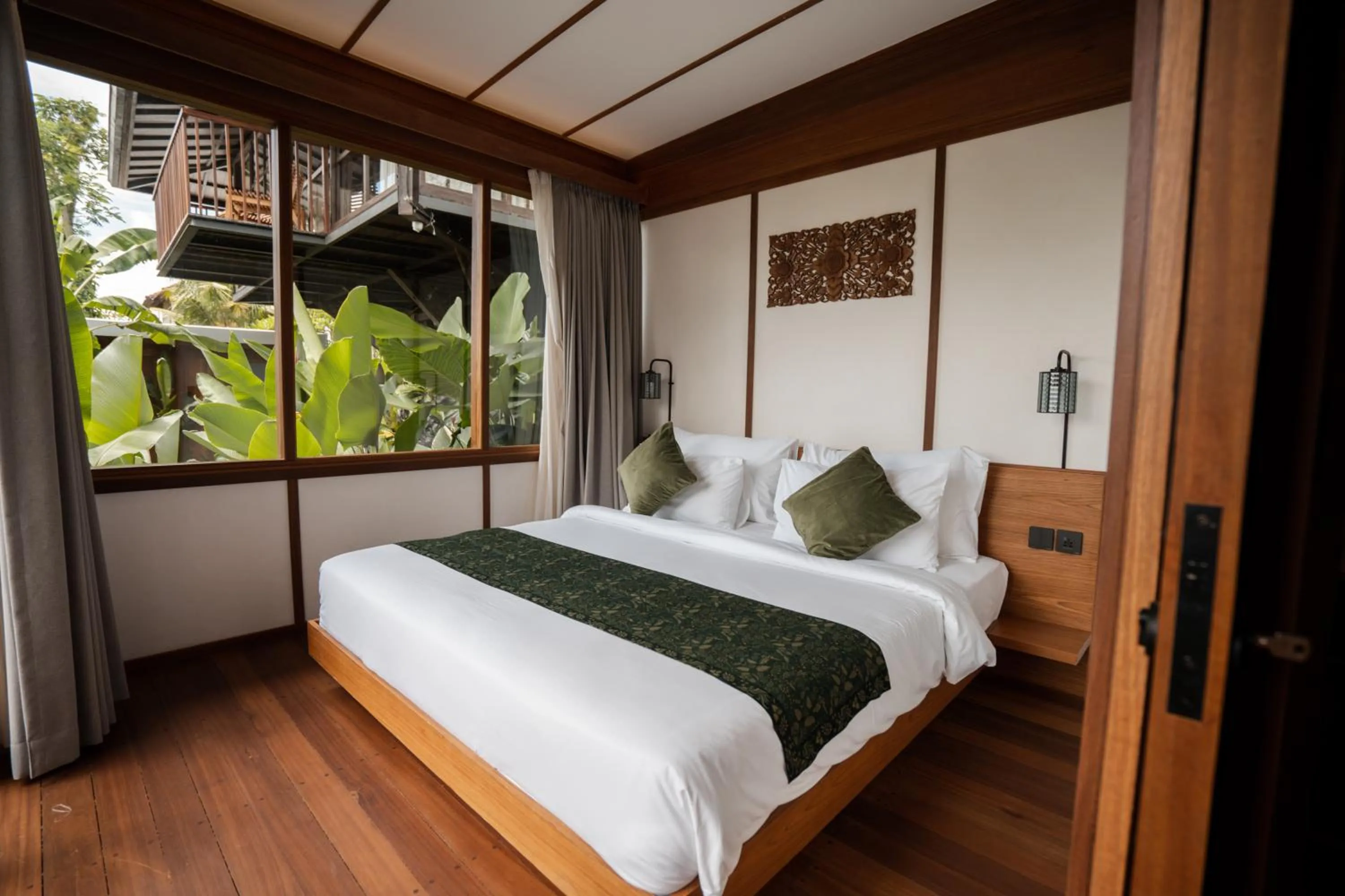 Bed in Grün Ubud