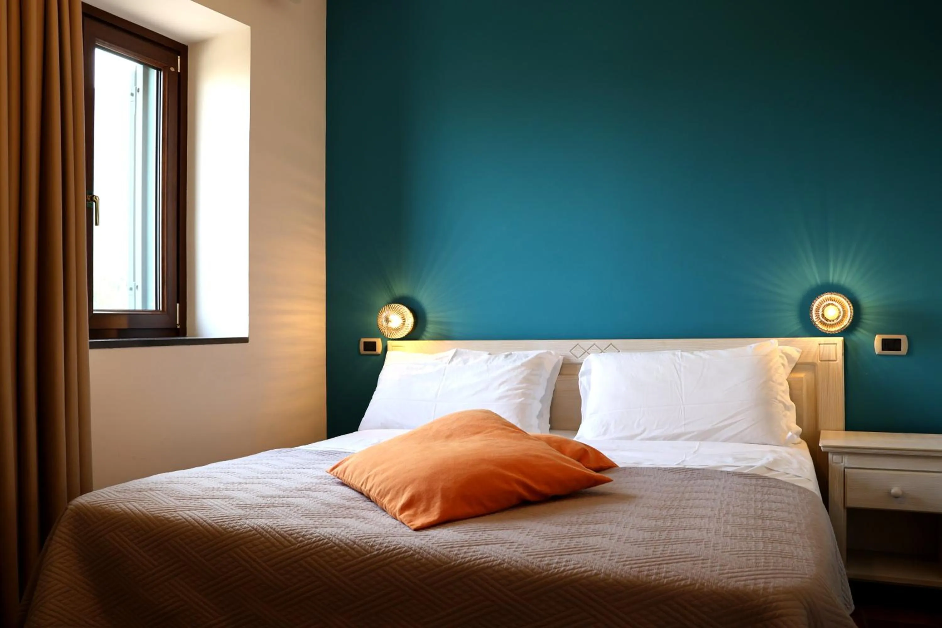 Bed in Casa Fifina Rooms