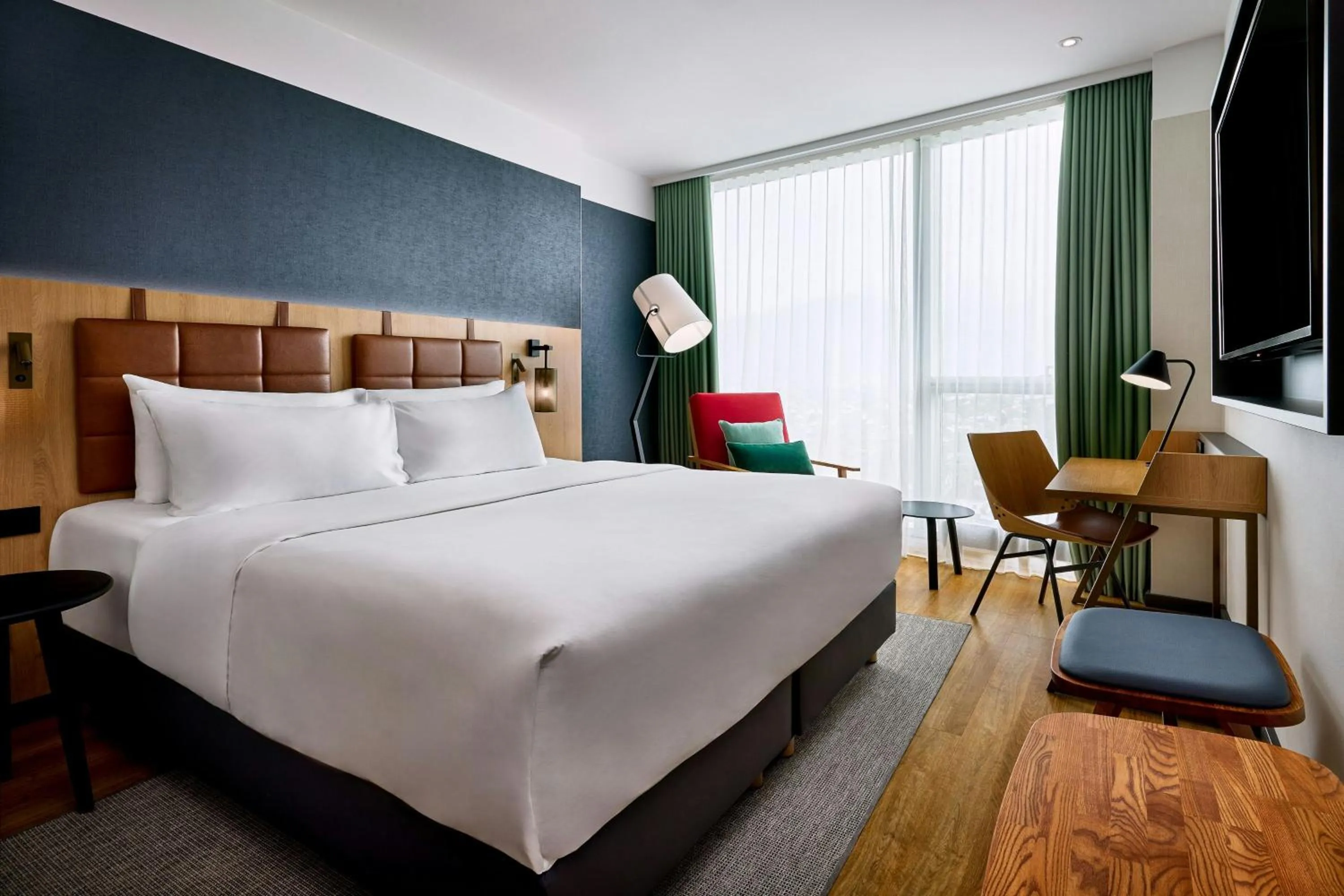 Photo of the whole room, Bed in Four Points by Sheraton Panoramahaus Dornbirn