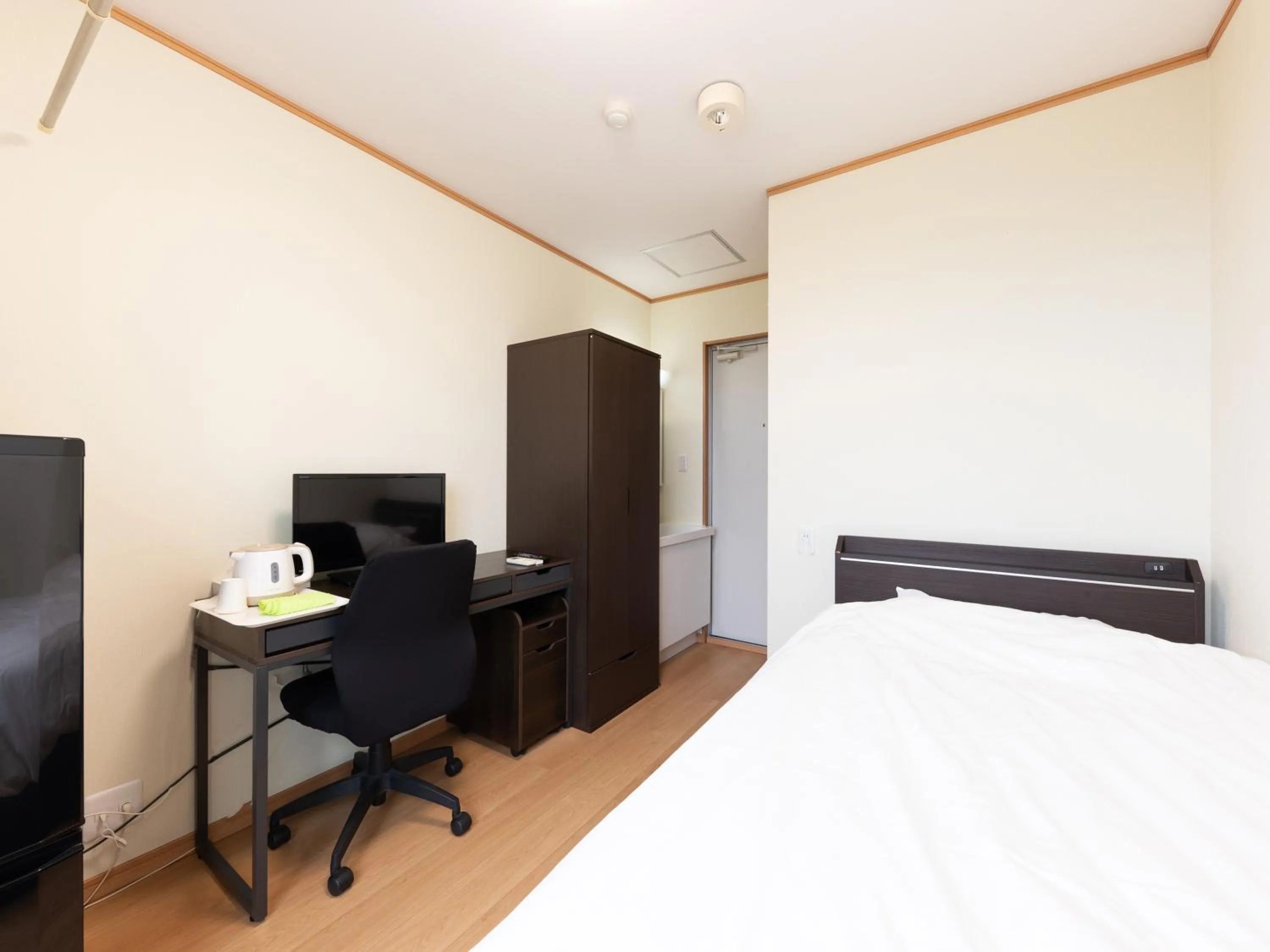 Bed in Tabist Hotel Takagiya Iwaki