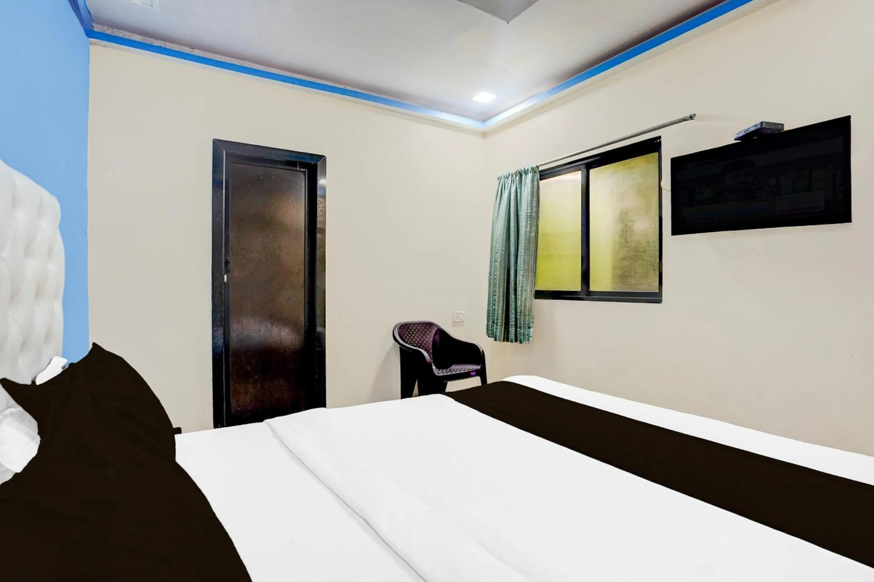 Bedroom, Bed in Hotel O The Om Sai Residency