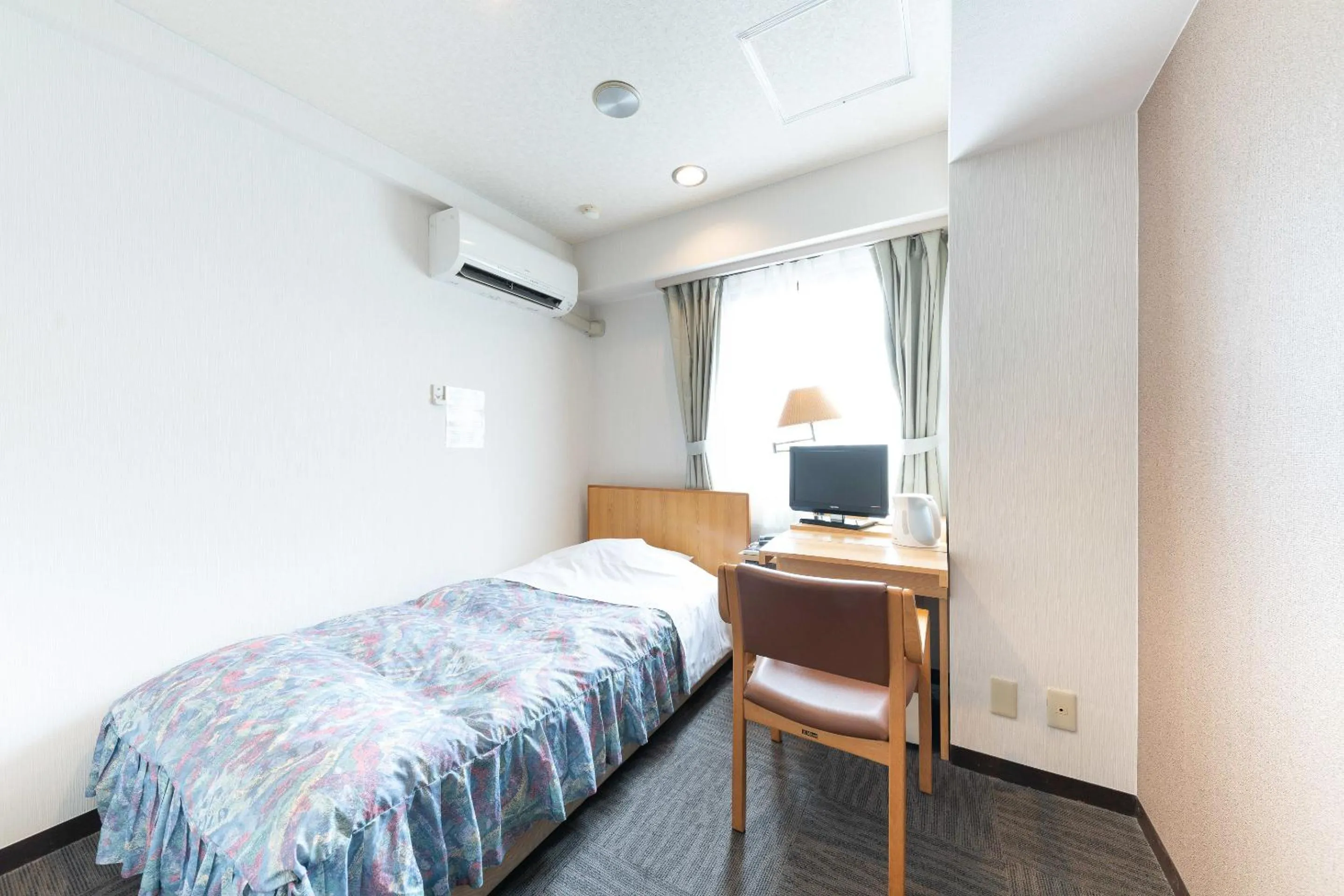 Bed in Tabist Hotel Diana Yachiyodai