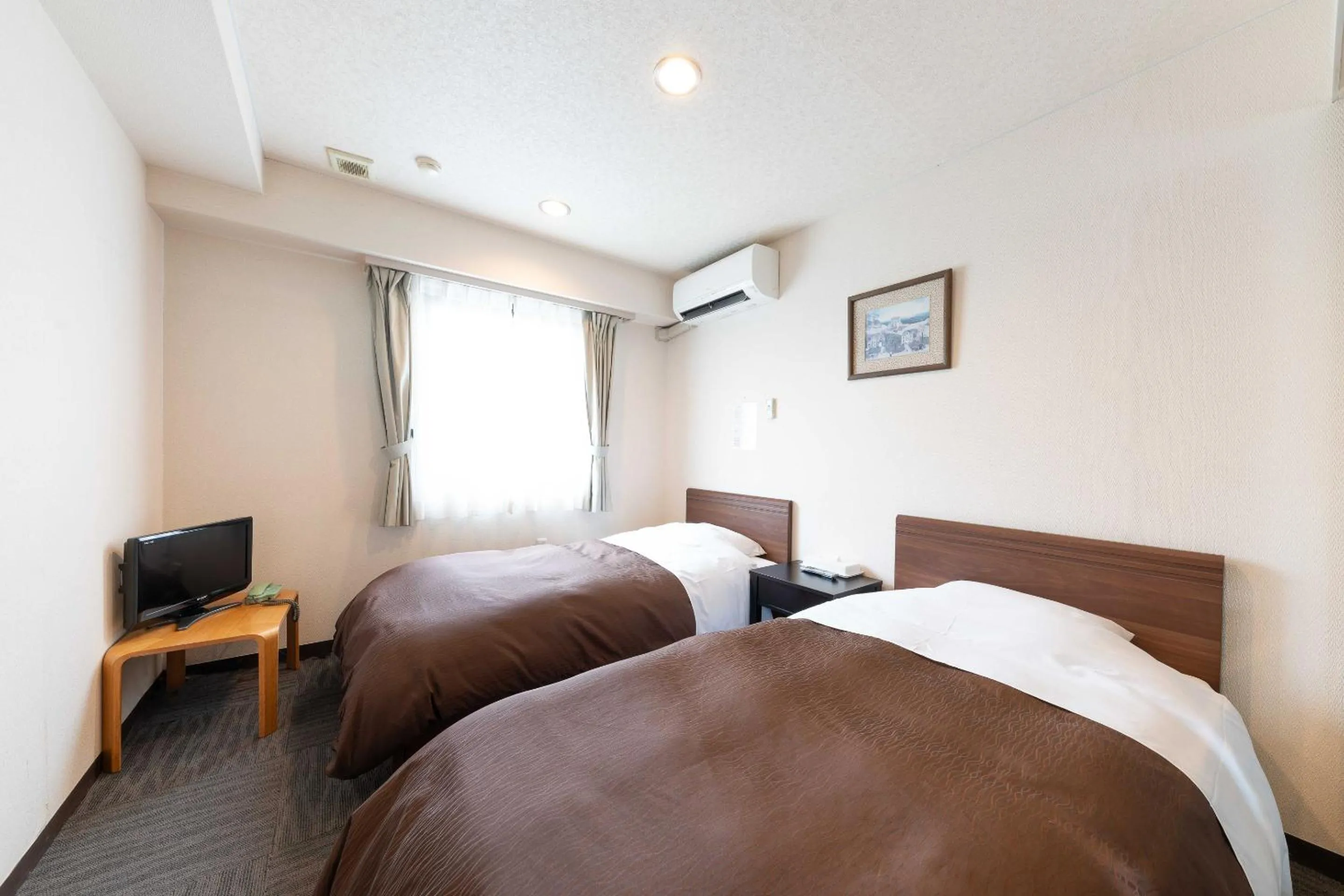 Bed in Tabist Hotel Diana Yachiyodai