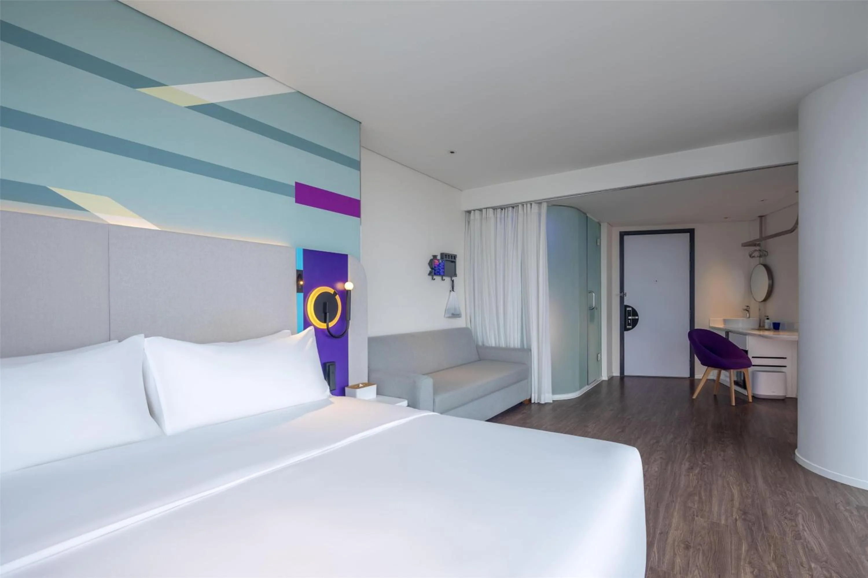 Living room, Bed in Tru by Hilton Hanoi Station