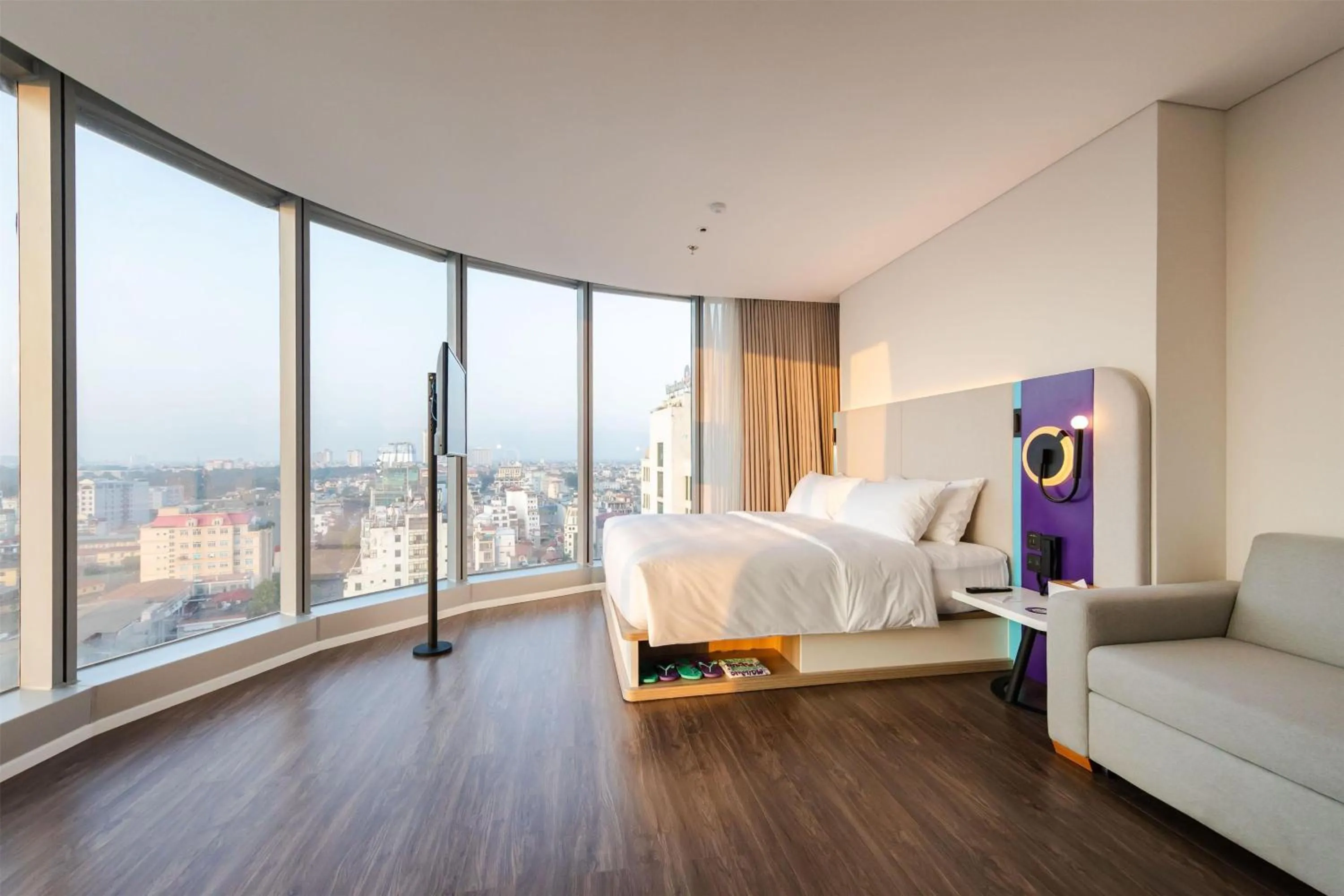 Living room, Bed in Tru by Hilton Hanoi Station