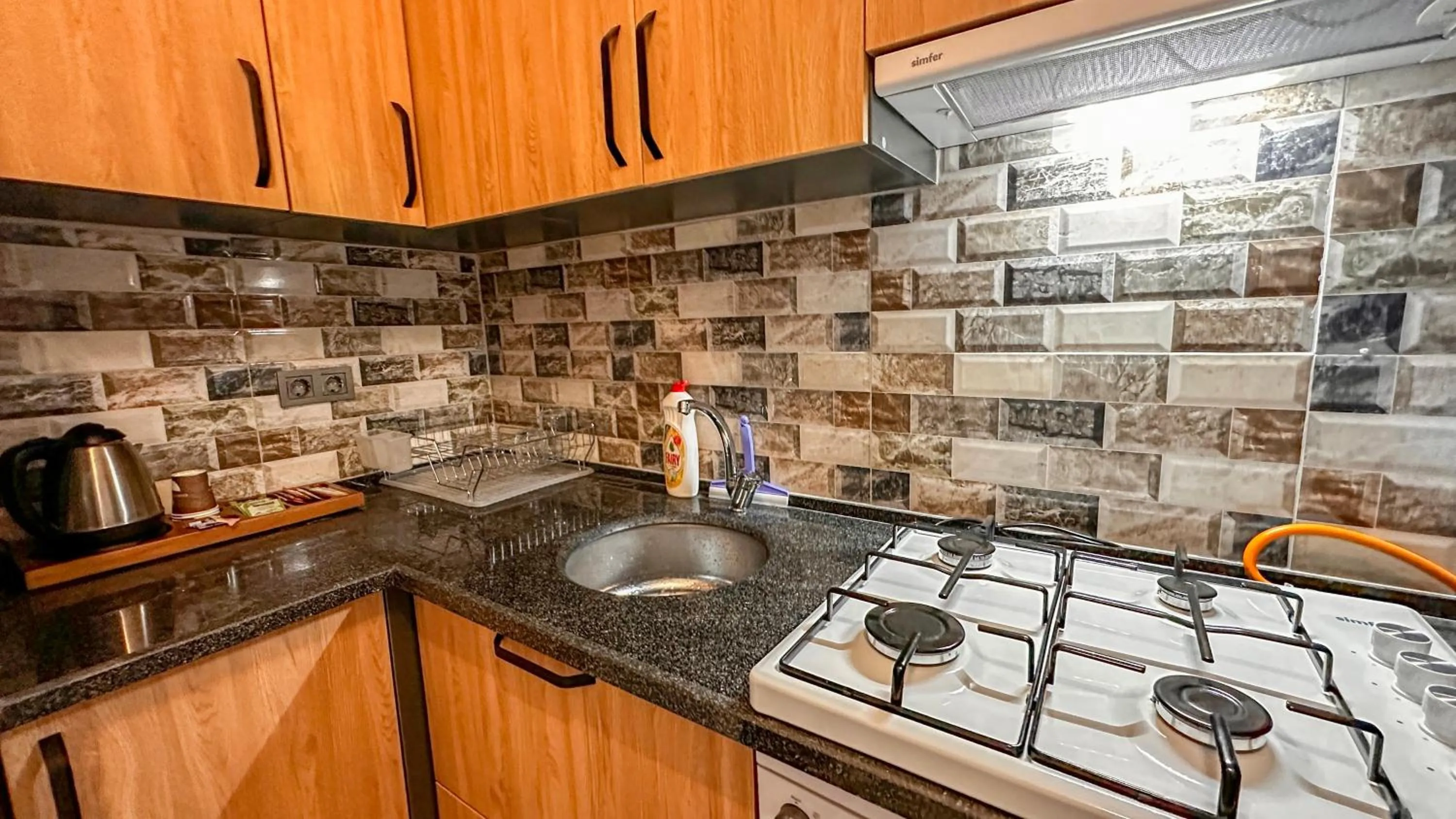 Kitchen or kitchenette in Mykonut Boutique Suites