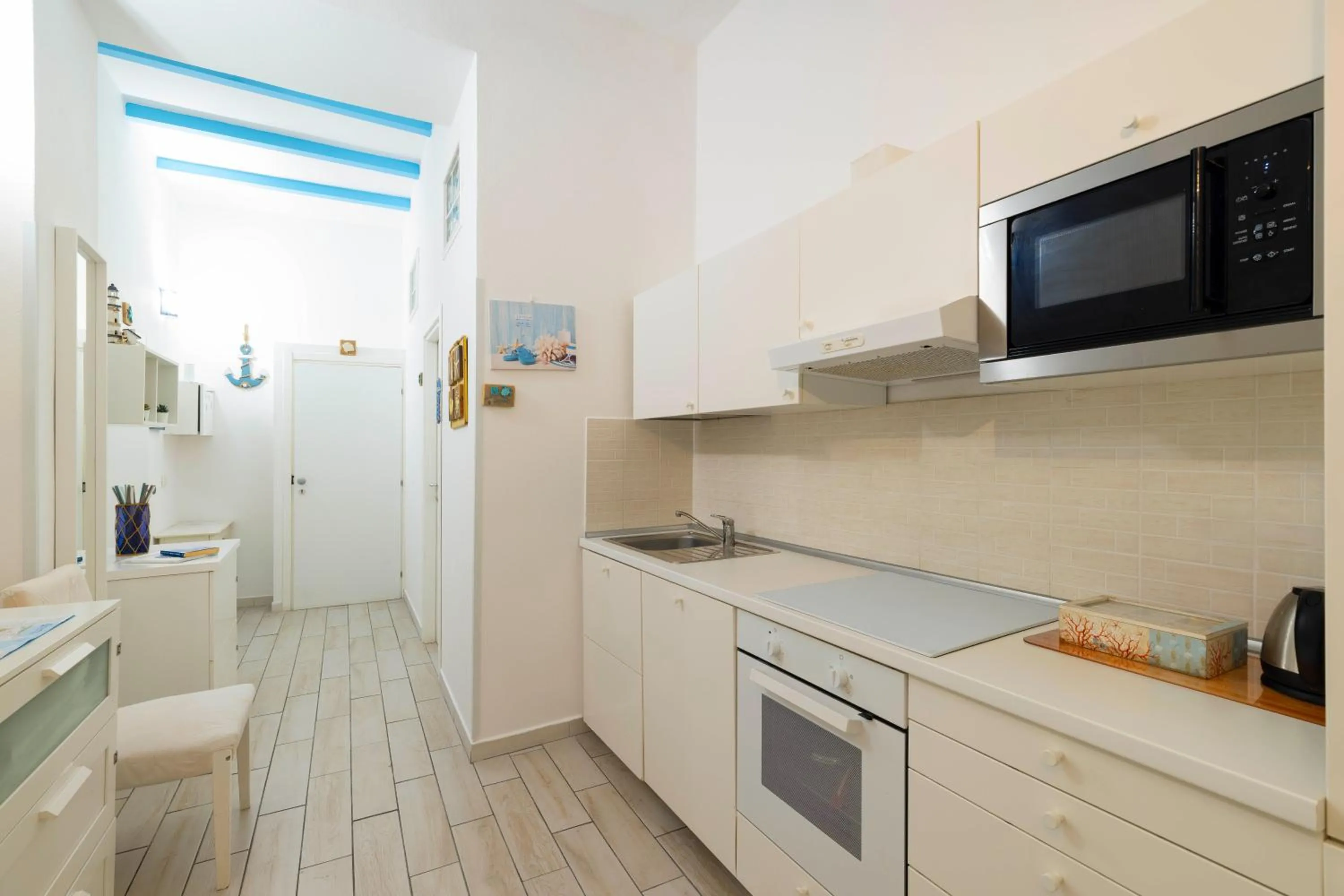 Communal lounge/ TV room in Approdo Rooms - Eja Sardinia