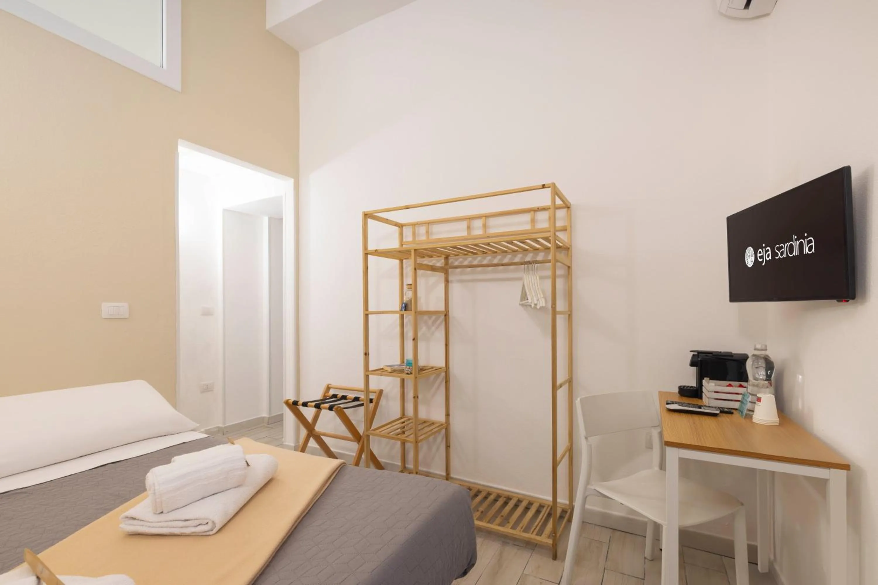 Bed in Approdo Rooms - Eja Sardinia