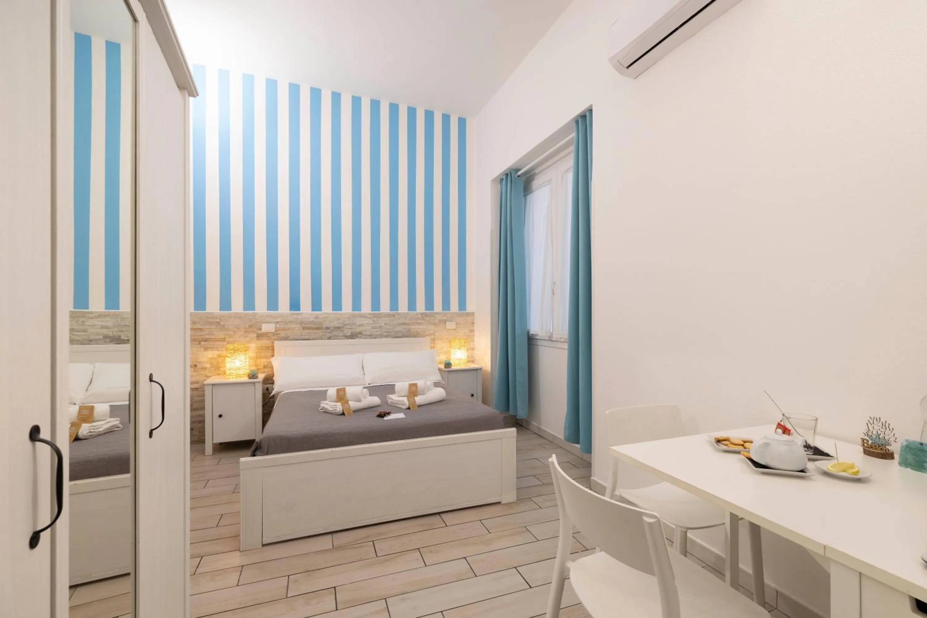 Bed in Approdo Rooms - Eja Sardinia