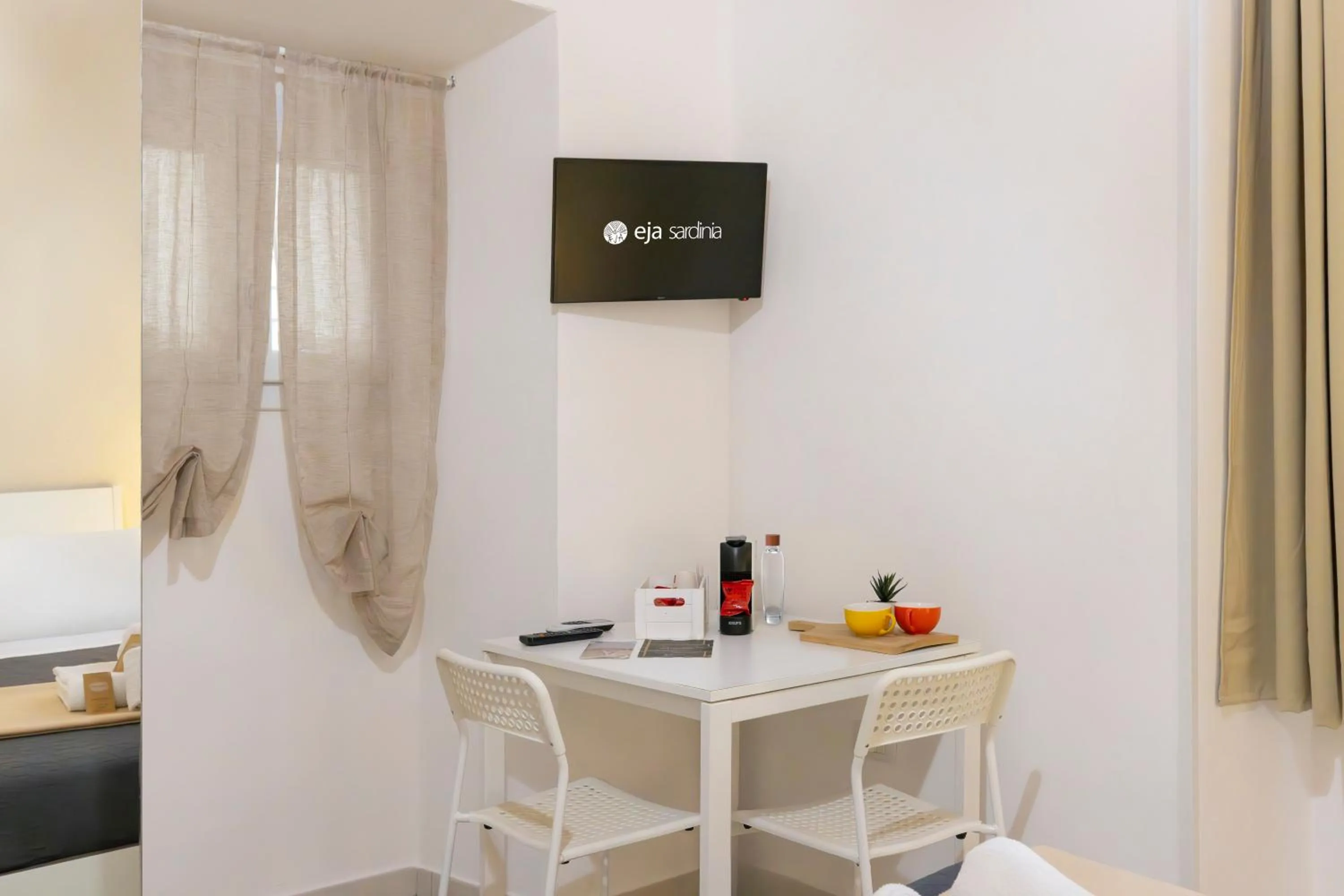 Bed in Approdo Rooms - Eja Sardinia