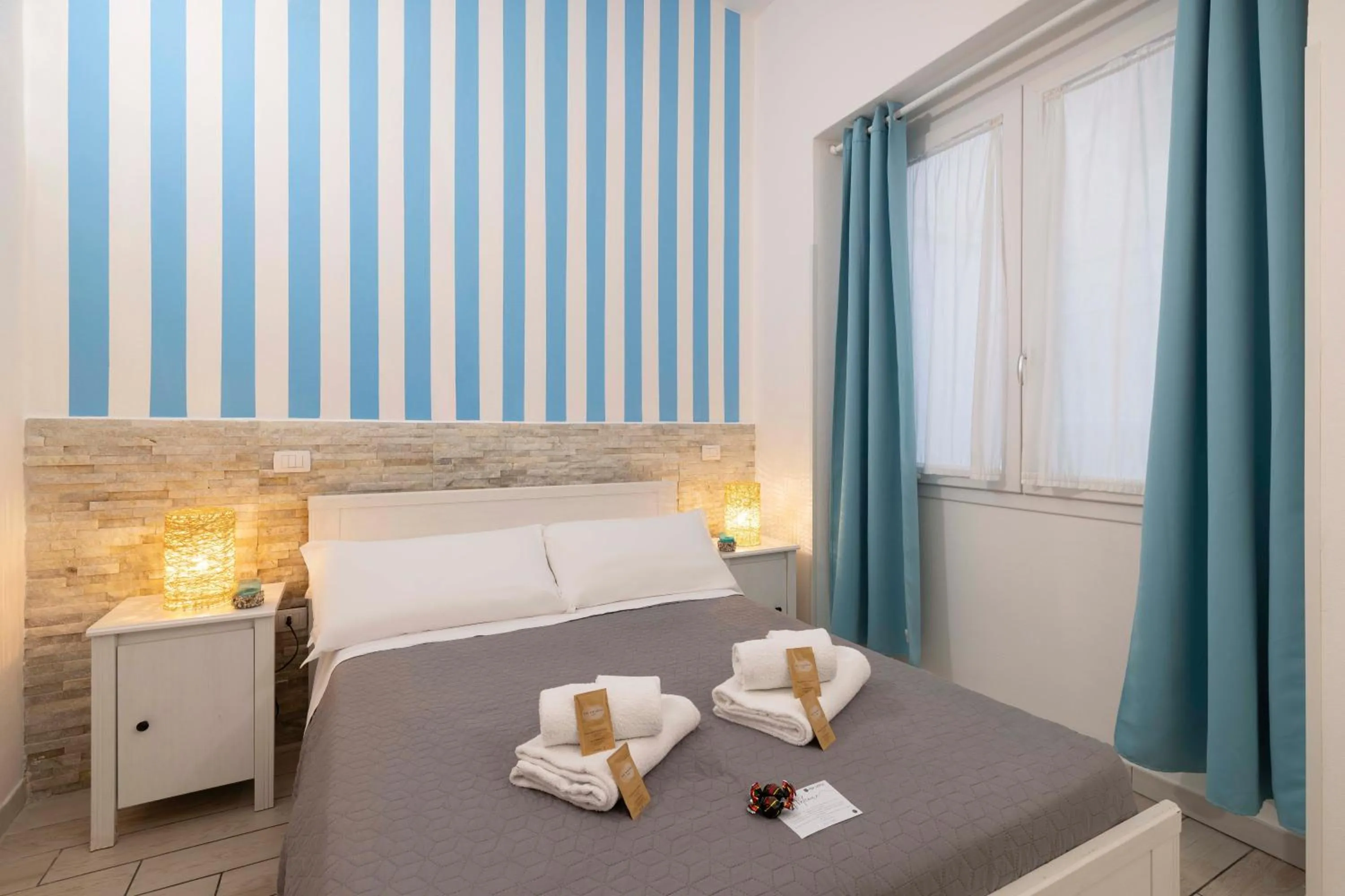 Bed in Approdo Rooms - Eja Sardinia